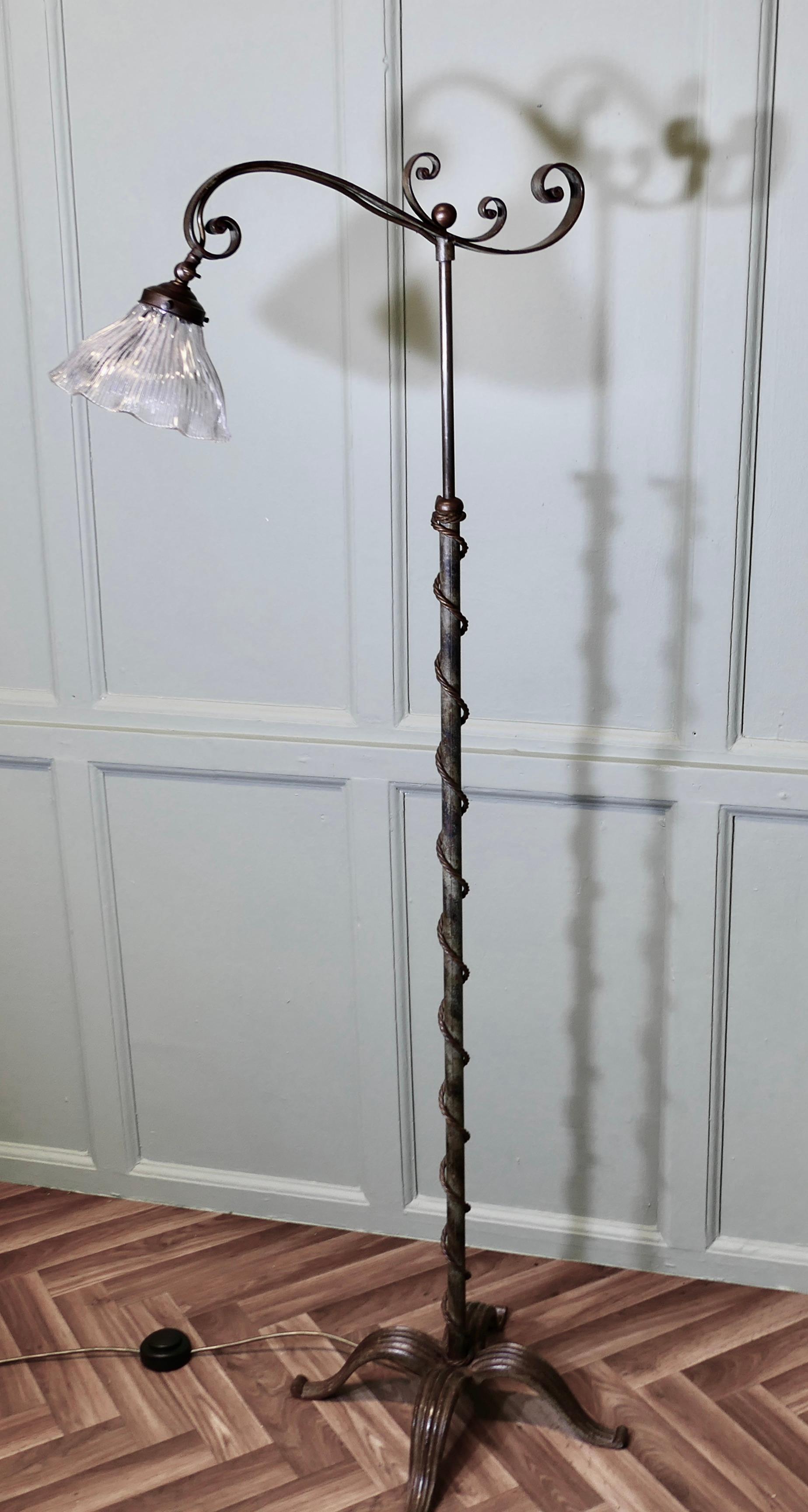 Very Unusual Arts and Crafts Telescopic Floor Lamp 

A very attractive and unusual piece, the lamp is made in wrought iron and has decorative brass work, the lamp has a twisted cord in brass wound around the central column.
The lamp is set on an