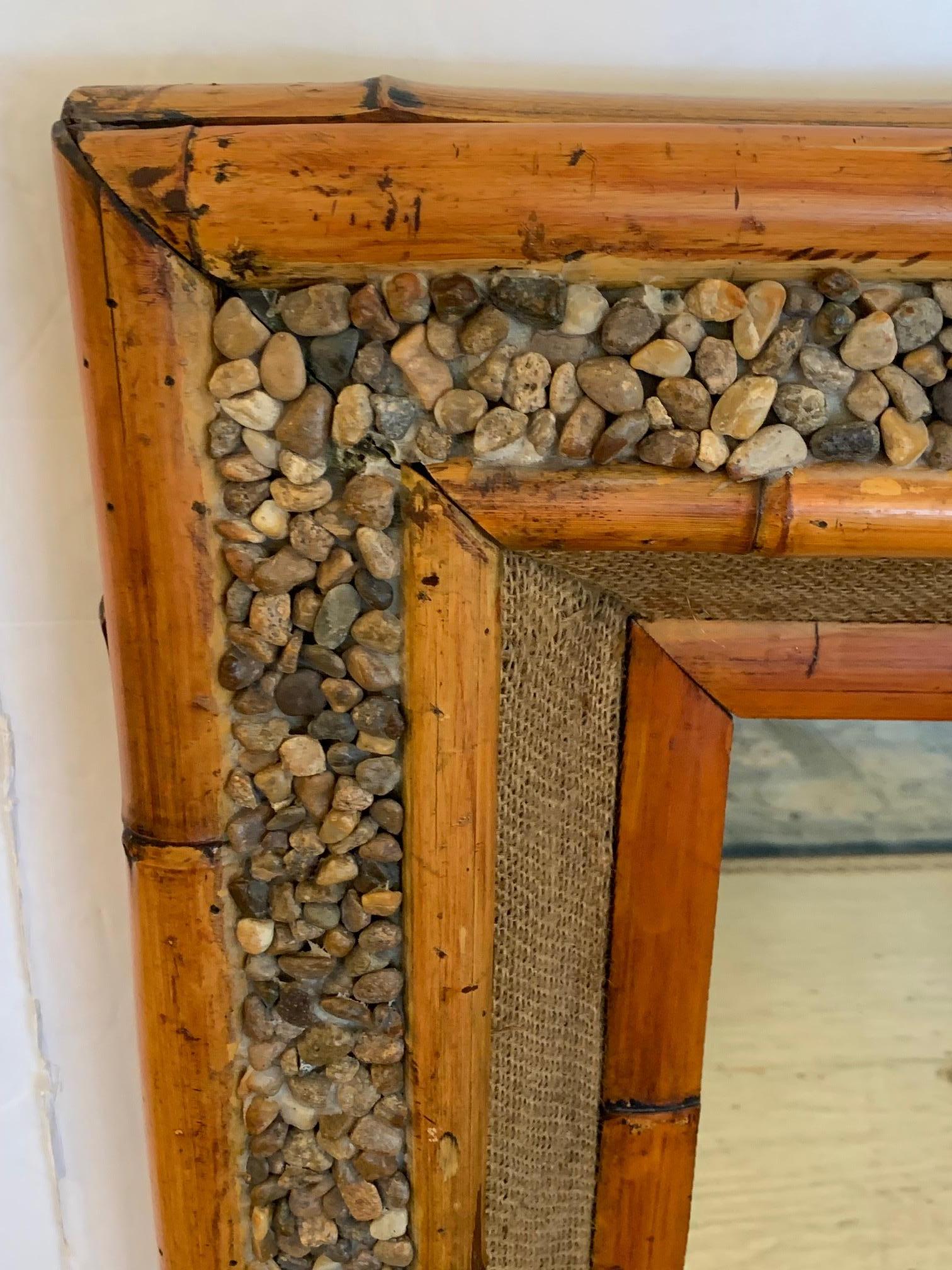 Super cool organic mix of real bamboo, natural pebbles and burlap framed mirror.
Mirror is 18 W x 24 H.