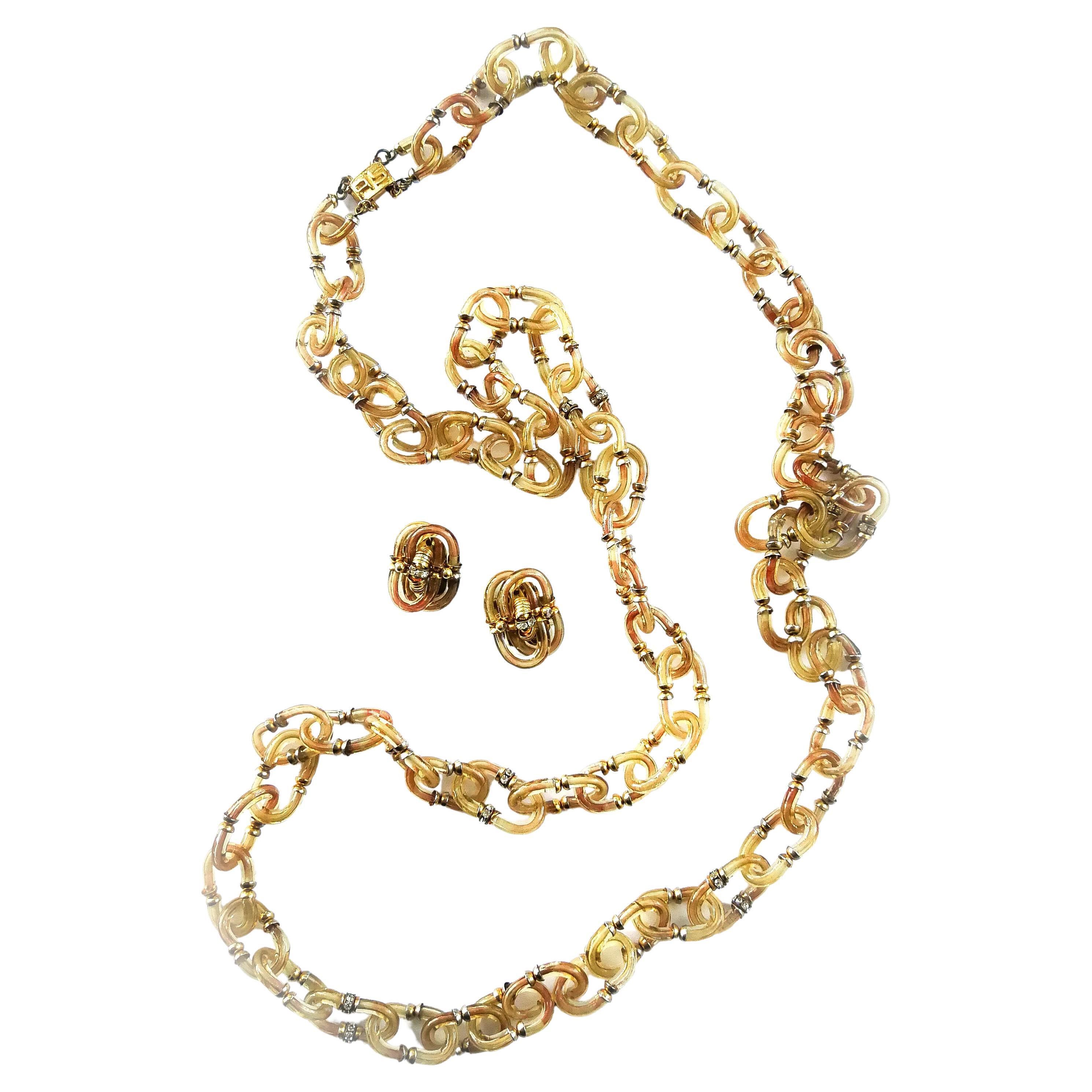 An exceptional and delicately coloured, exceptionally long glass chain necklace, made by Archimede Seguso, part of a specially commissioned collection by Chanel in the late 1960s.  In a delicate and refined citrine colour overall, there are touches