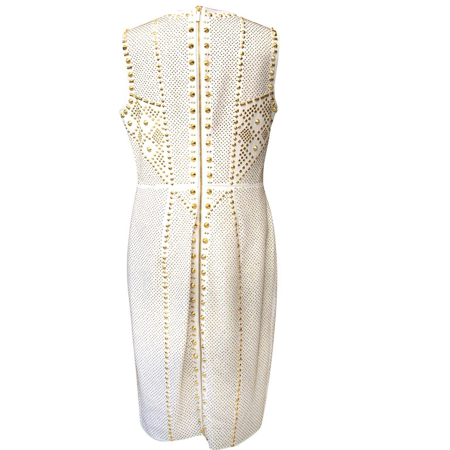 retail price €7500

A real must have this Versace leather dress. 
This eyecatching dress features a studded geometric design that brings optical interest while contouring an hourglass silhouette. 

Very soft white calfskin finished with contrasting