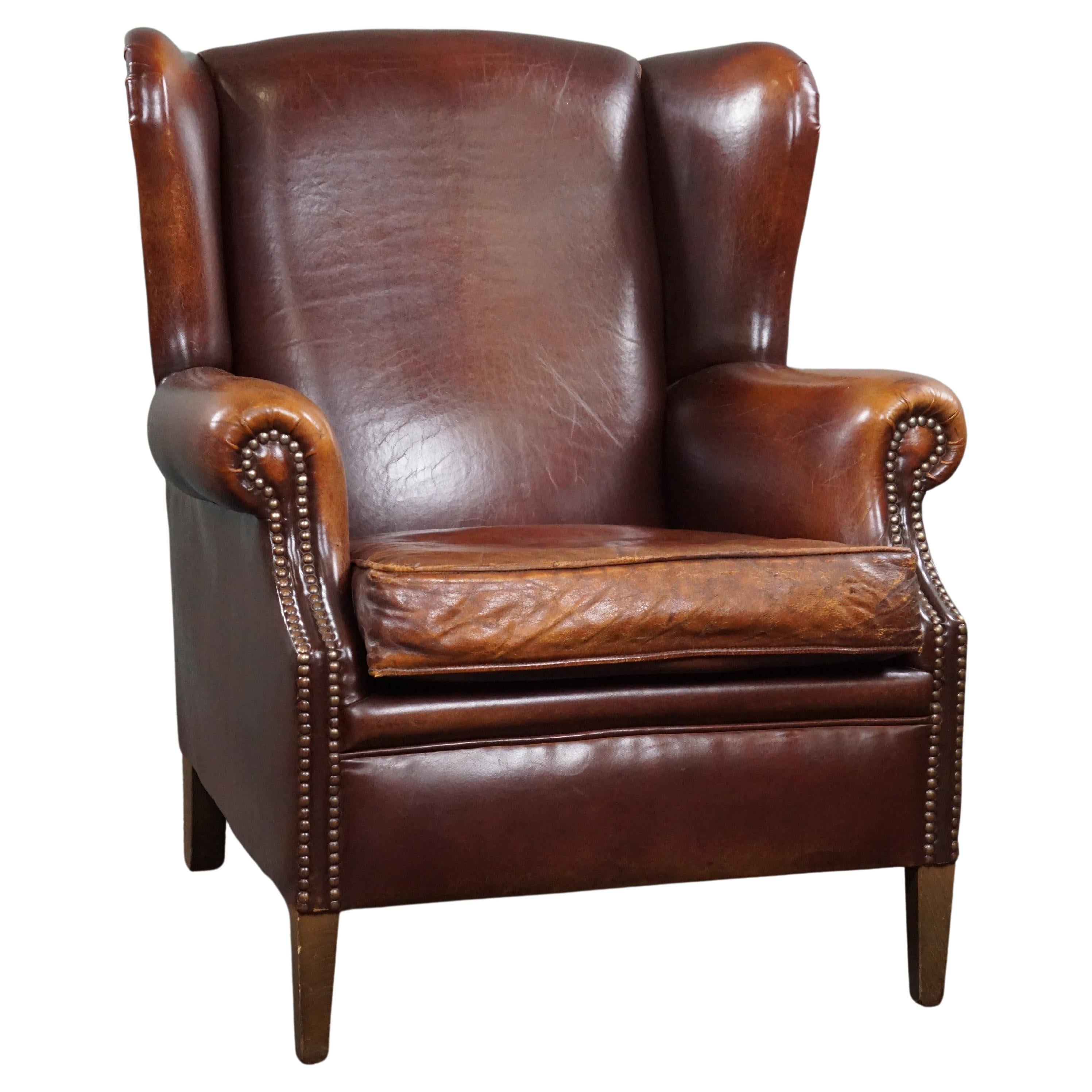 Very warm colored sheep leather wing chair  For Sale