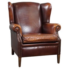 Used Very warm colored sheep leather wing chair 