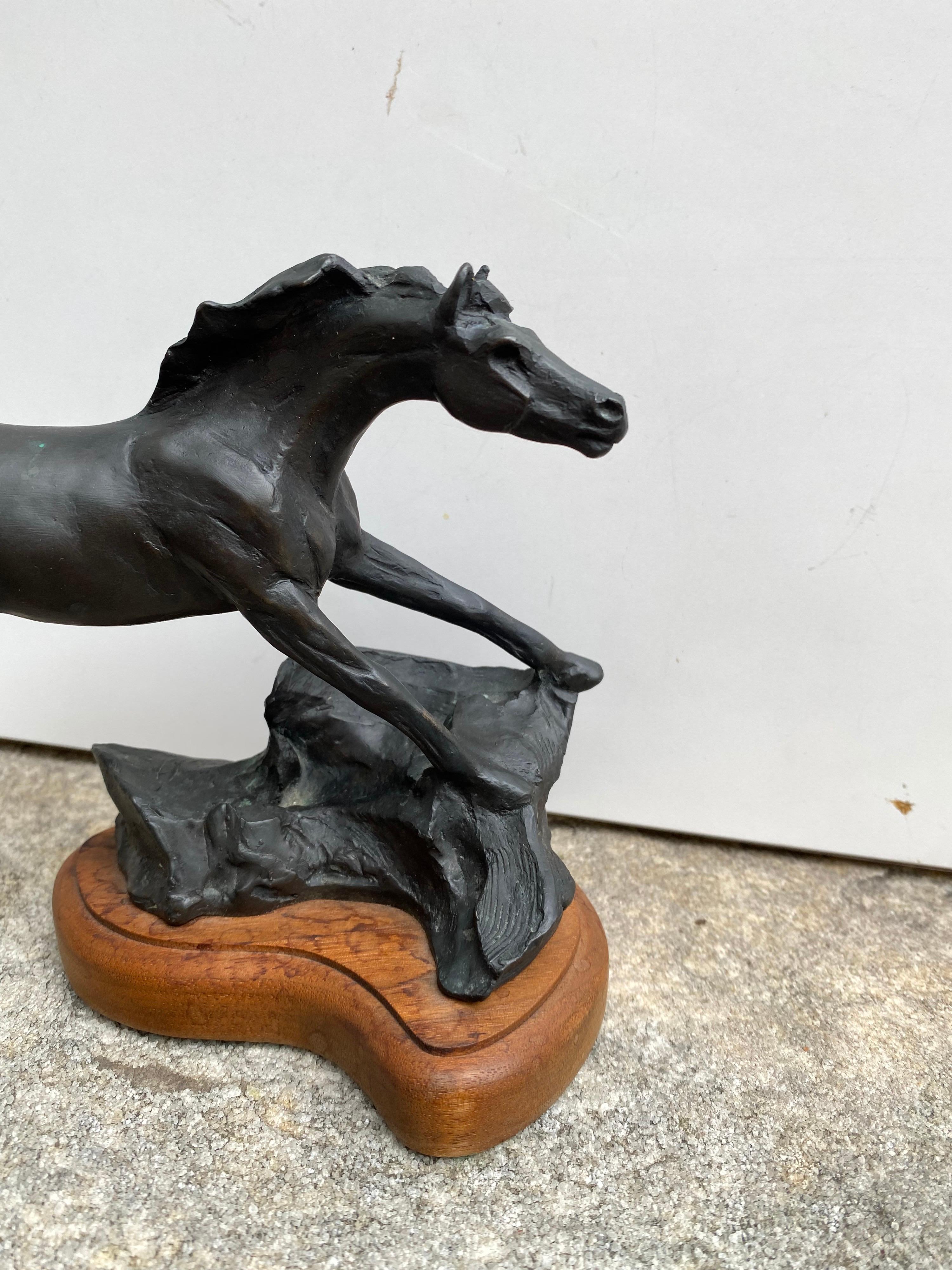 Veryl Goodnight bronze Horse dated 1989. Horse is mounted on a wood base. Known for her Western and Animal Subject matter.
