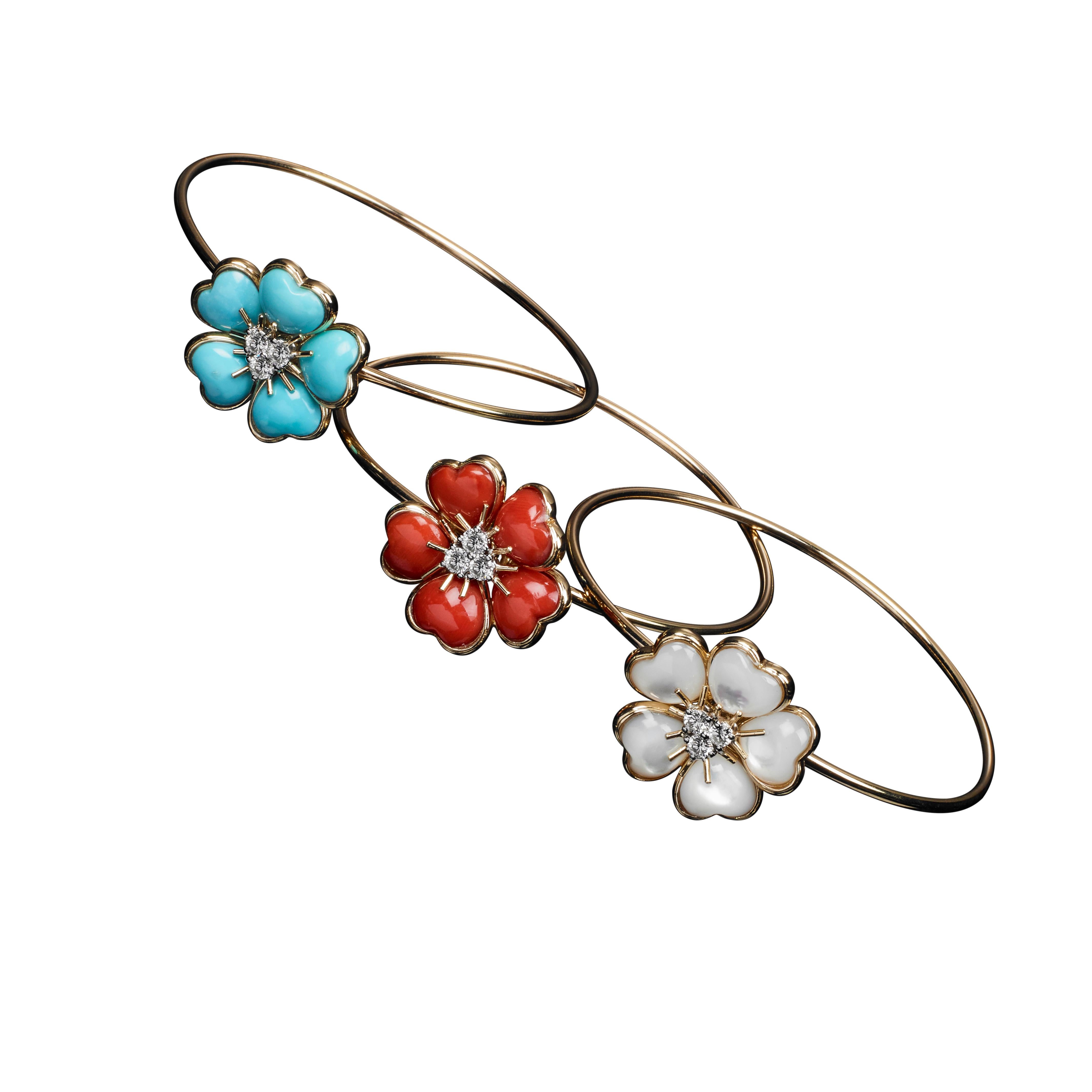 18 kt Yellow Gold Bracelet adorned with a nice and charming central flower featuring Red Coral Inlays, enriched with 0,32 carats of Brilliant-cut Diamonds, G colour, IF clarity.
The bracelet is part of the lovely, multi-coloured, joyful Collection: