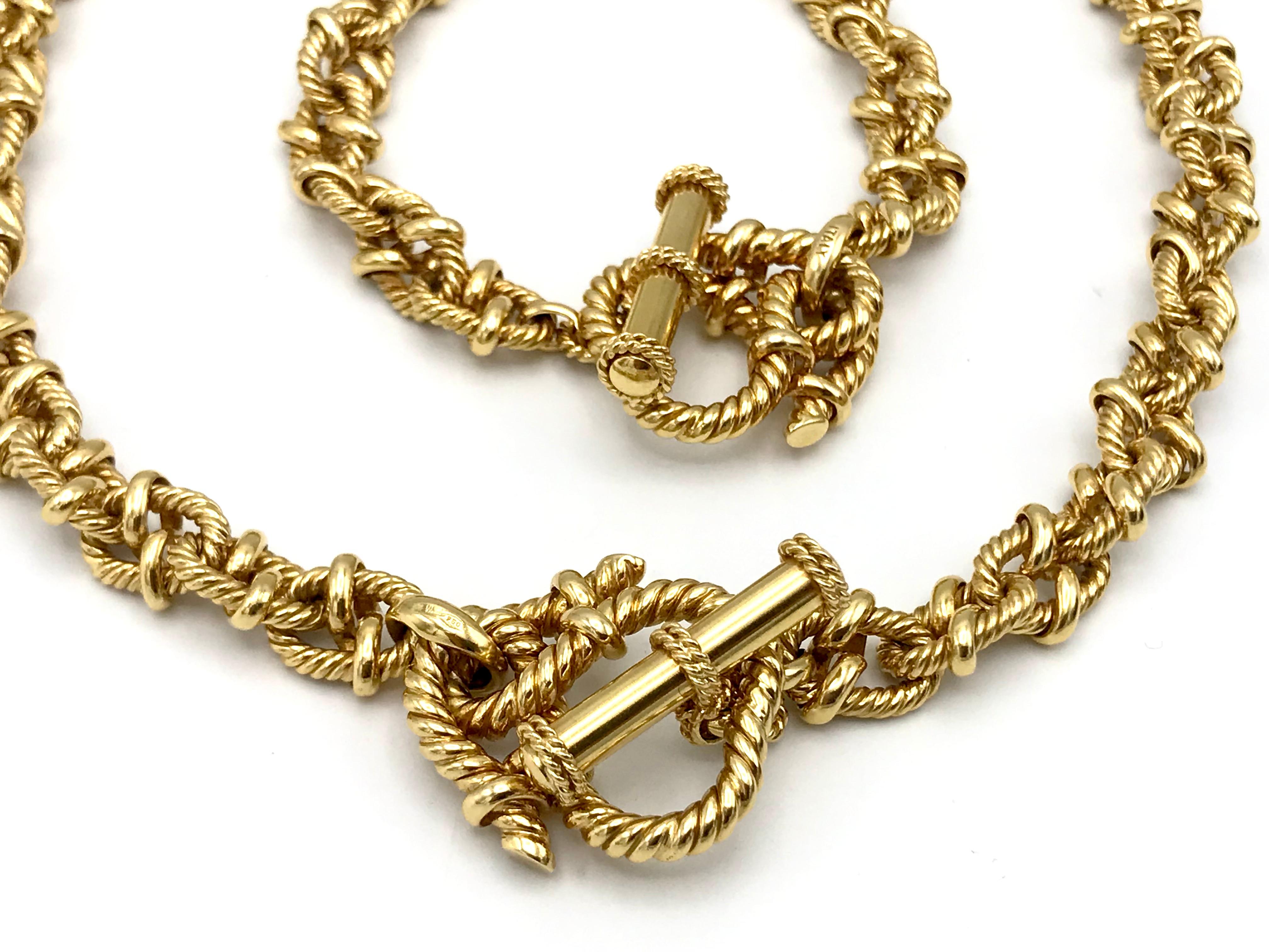 Vesco 18k yellow gold rope chain set featuring a necklace and a bracelet. Both have a toggle clasp. Stamped with Vesco maker's mark, a hallmark for 18k gold and a country of origin (Italy).
Measurements: The necklace is 16.5