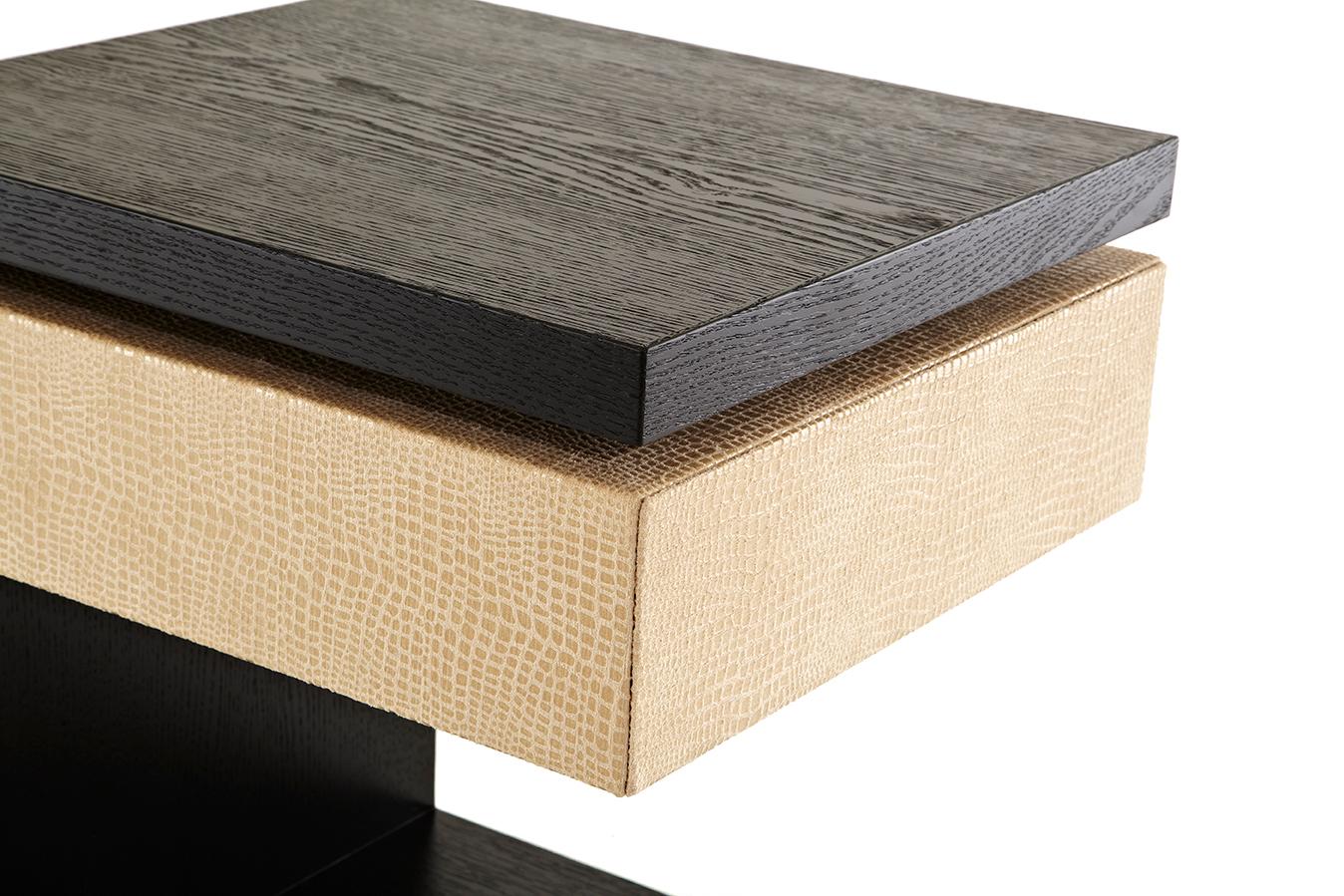The Vesey side table provides a simple concept for a simple table with deep, rich stained oak and a floating box wrapped in luxurious faux boa skin. Its slim and clean profile is ideal for small spaces while the single drawer provides convenient