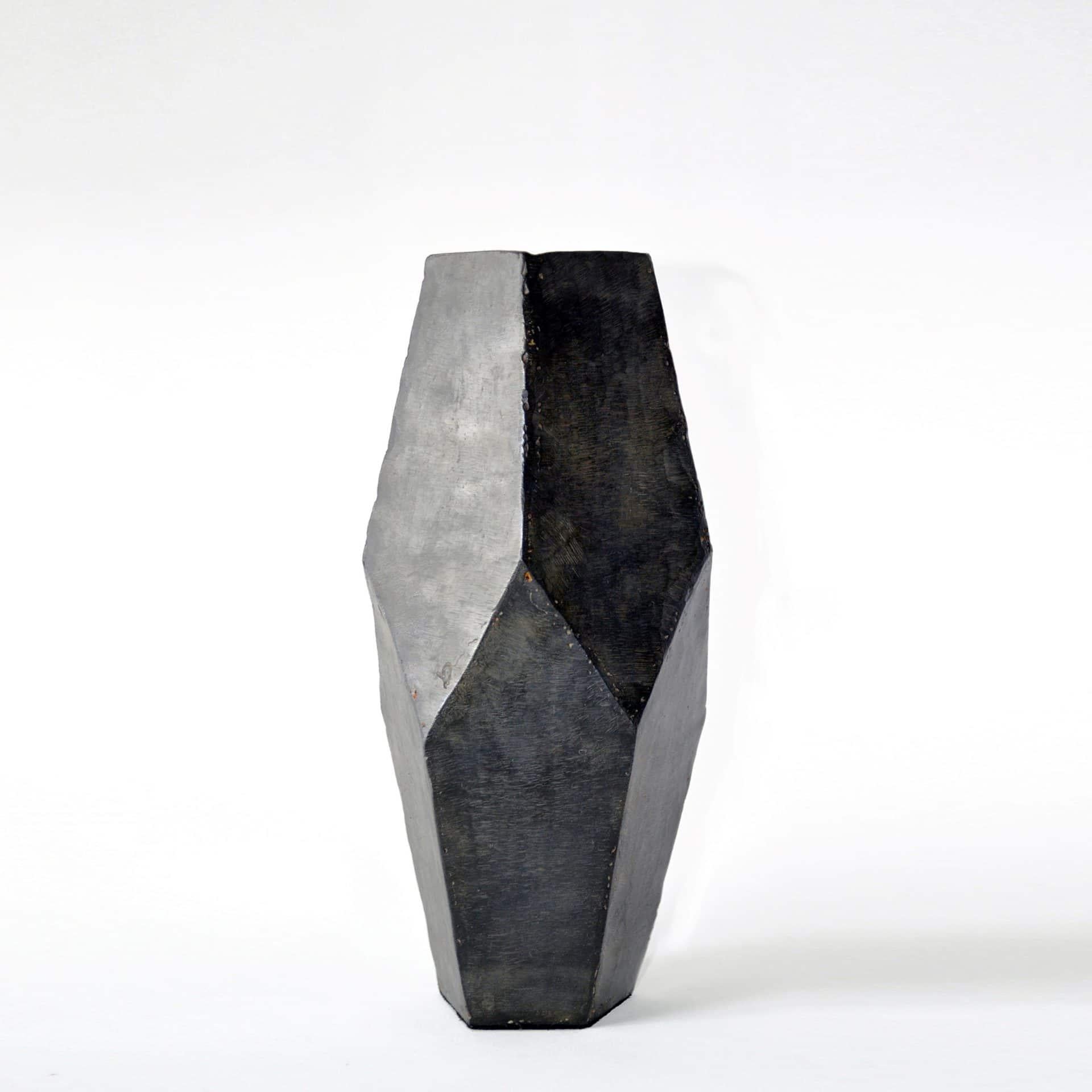Ten facets form this unique object. Mathematically designed and hand-wrought. Vessel no. 1 was the first vessel designed by J.M. Szymanski.

Blackened steel, waxed finish, suede base.

Each vessel is unique and will vary slightly in size and
