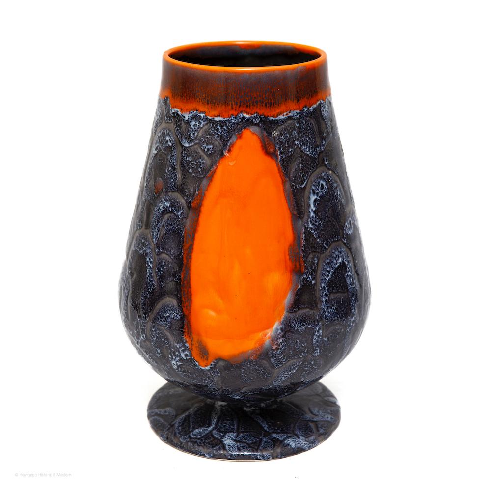 Contemporary vessel, orange & grey, 24” high 

Striking, lively vessel exploring colour and texture juxtapositions
The right orange is balanced by the grey background and the contrast between them is intense
The artist also contrasts a smooth,