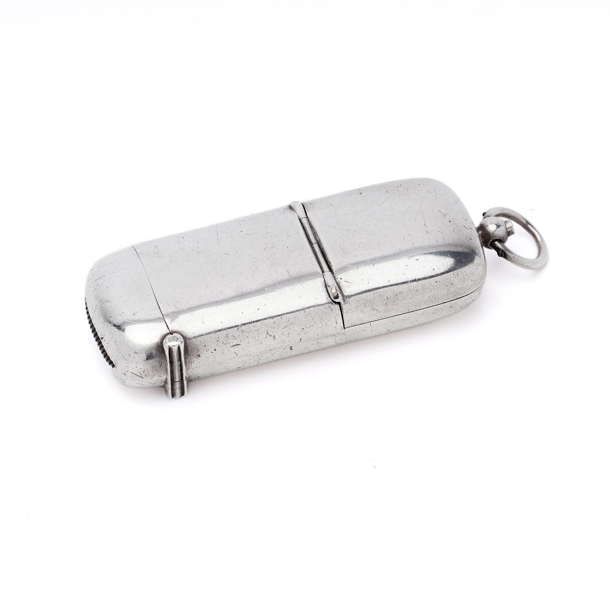 Antique sterling silver vesta case combined with sovereign case in one. Also can be attached to key ring.
Maker: W & Co Ltd 
Made in England, Birmingham 1908
Fully hallmarked. 

Dimension:
Length: 8.3 cm
Width: 3 cm
Depth: 1.5 cm
Weight: 47