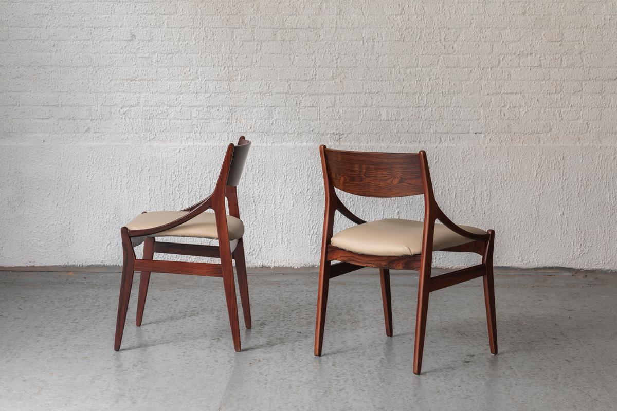Set of 4 dining chairs designed by Vestervig Eriksen in Denmark in the 1960’s. The chairs feature an organically shaped frame made of solid rosewood and veneer with seats in a new soft grey fabric upholstery. Apart from some minor wear in very good