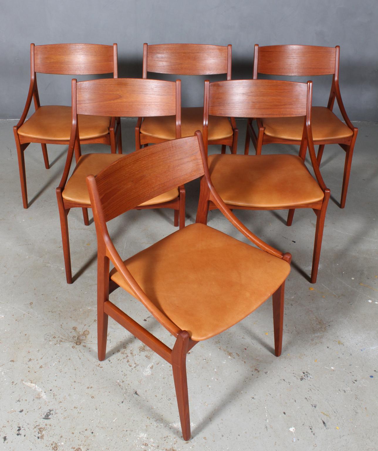 Vestervig Eriksen set of six dining chairs in partly solid teak. 

Seats new upholstered with tan vintage aniline leather.

Made by Brdr. Tromborg’s Eftf., Møbelfabrik Vestervig Eriksen Aarhus.