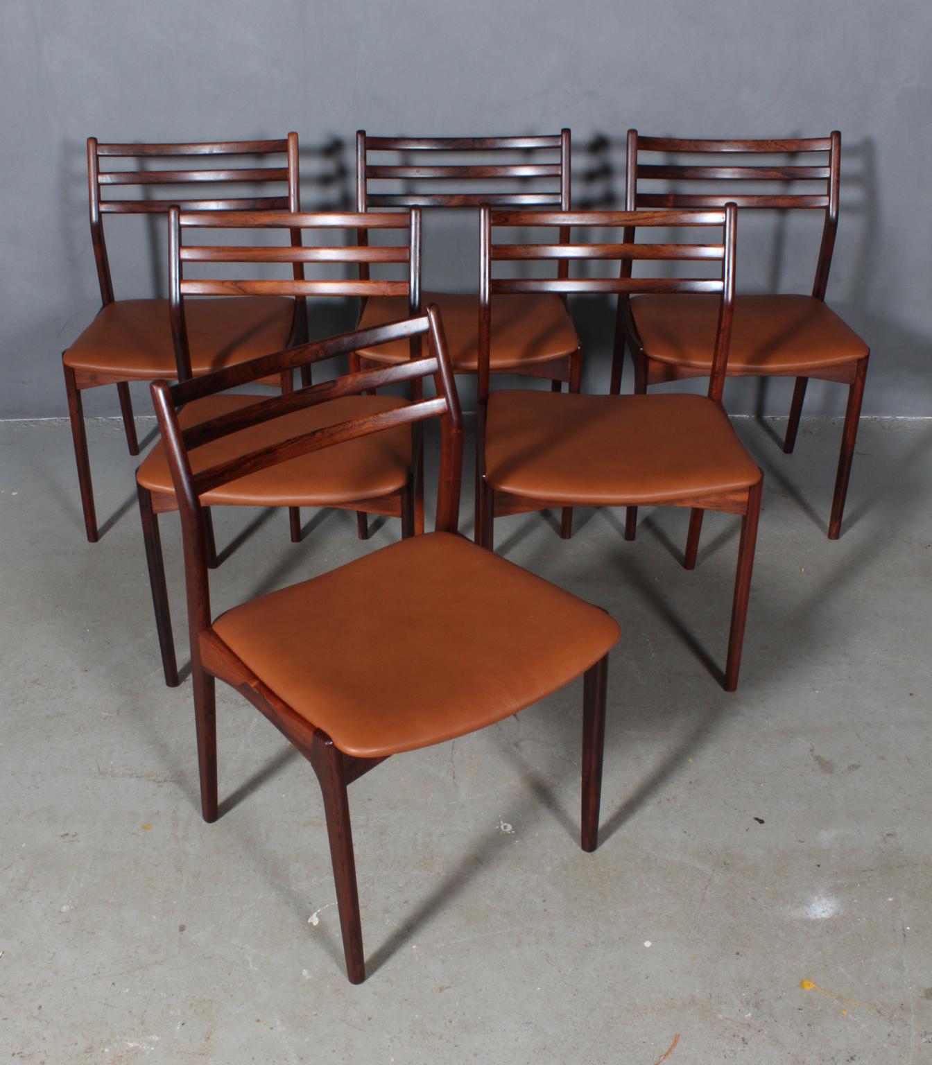 Vestervig Eriksen set of six dining chairs in partly solid rosewood. 

Seats new upholstered with tan pure aniline leather.

Made by Brdr. Tromborg’s Eftf., Møbelfabrik Vestervig Eriksen Aarhus.