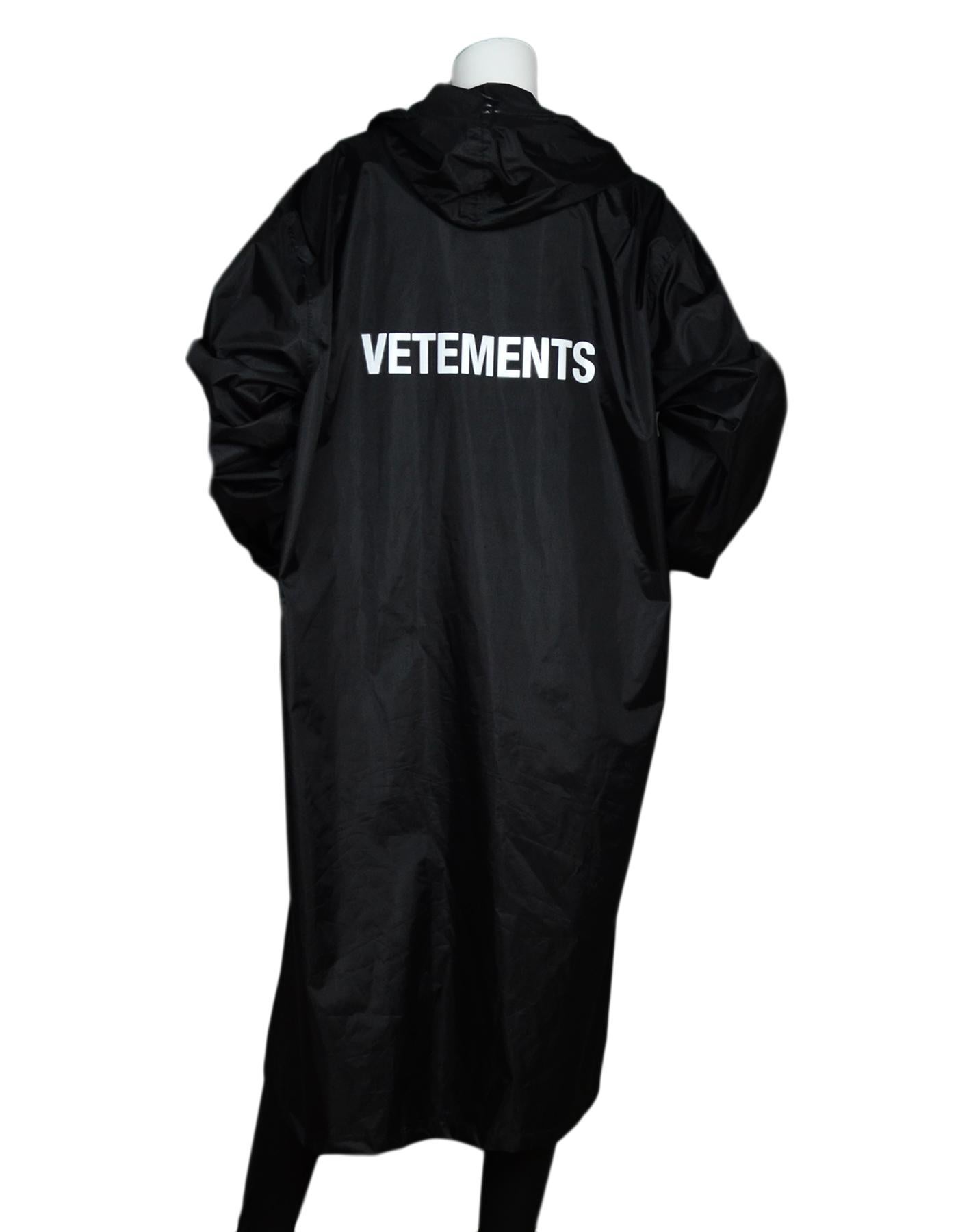 Vetements 2016 Black Nylon Hooded Long Raincoat Sz XXL 

Year of Production: 2016
Color: Black
Materials: Nylon
Opening/Closure: Zipper front with button closure 
Overall Condition: Excellent pre-owned condition 

Measurements: 
Shoulder To