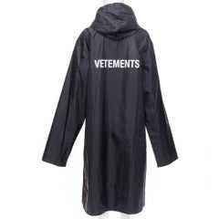 VETEMENTS 2016 black nylon off gold logo longline hooded rain coat