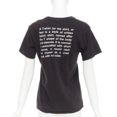 Camiseta de cuello redondo VETEMENTS 2017 de algodón negro con explicación de fuentes blancas