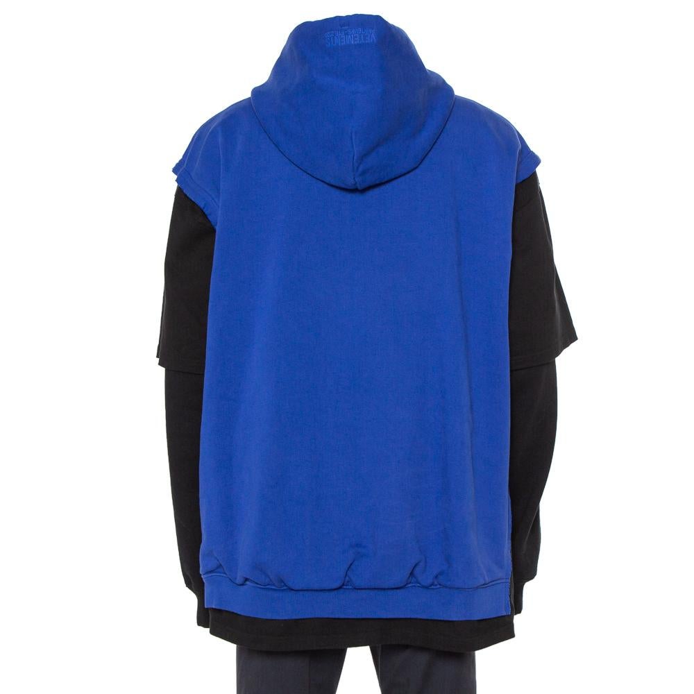 This black & blue hoodie from Vetements comes with embroidered details on the front to light up your casual style. It is made from cotton and designed as a hoodie featuring a kangaroo pocket, long sleeves, and a hood. The oversized hoodie will pair