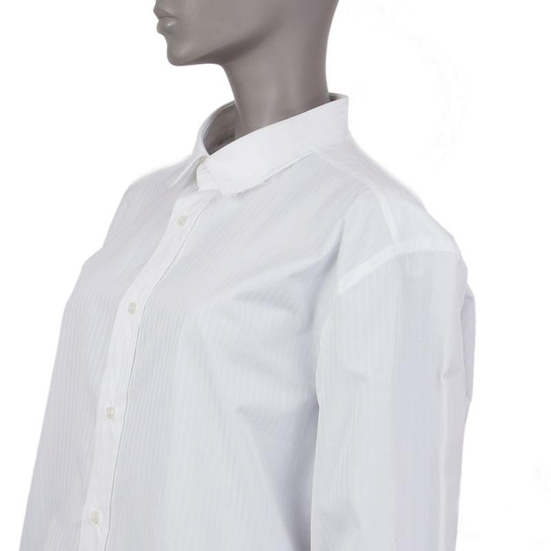 100% authentic Vetements + Brioni pin-stripe oversized shirt in white cotton (100%). With flat collar, straight yoke, two back pleats, patch pocket on the chest, one-button square cuffs, and frayed hemline and trims. Closes with small off-white