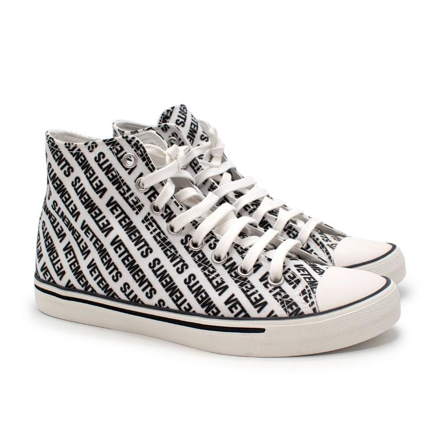 Vetements High-Top Canvas Black & White Printed Logo Sneakers

- Lace up
- Black logo printed on the white canvas
- Rubber sole
- Vetements logo printed on the rubber at the back

Materials:
Canvas
Rubber
Leather

PLEASE NOTE, THESE ITEMS ARE