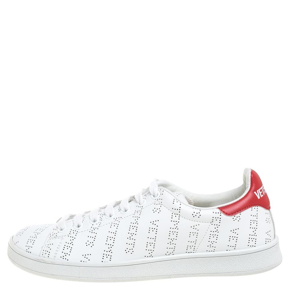 Let these sneakers by Vetements be your first choice if you're looking to add to your shoe collection. These white Vetements sneakers for women are crafted from leather and styled with perforated logo details and lace-ups on the vamps. They flaunt