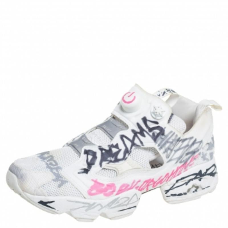 These chic sneakers are born from the Vetements x Reebok collaboration, taking into account both the brand's aesthetics. The fabric and mesh construction features an all-over display of a doodle print on Reebok's Instapump Fury design. Comfortable