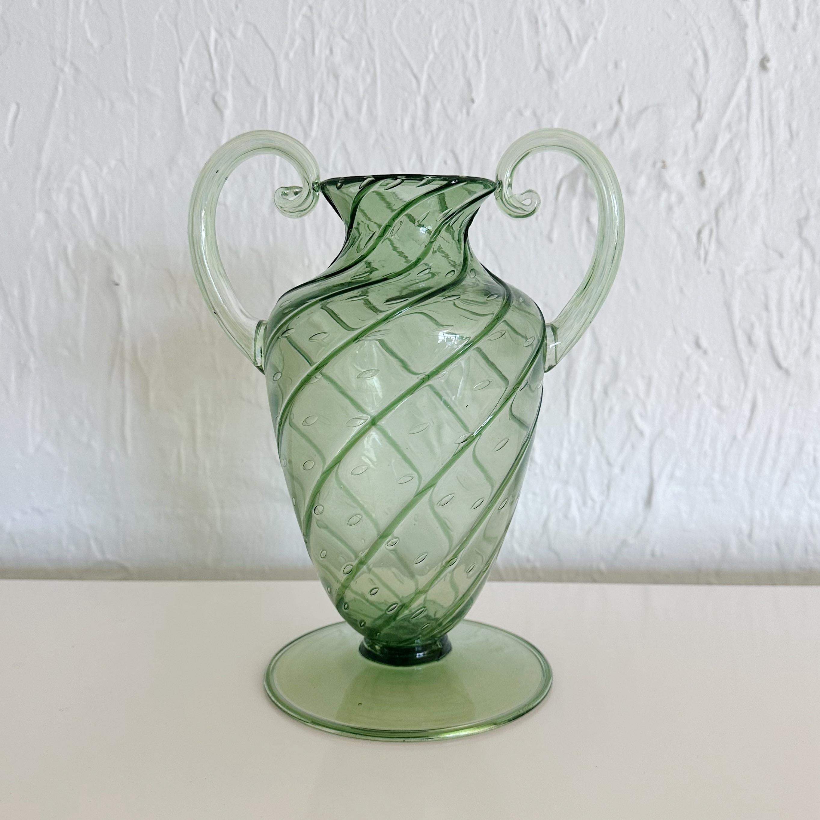 Hand blown Murano green glass Vetreria Fratelli Toso soffiato vase. Internally decorated glass with controlled air bubbles. Unsigned. Circa 1930. The opening to the vase measures 1.75