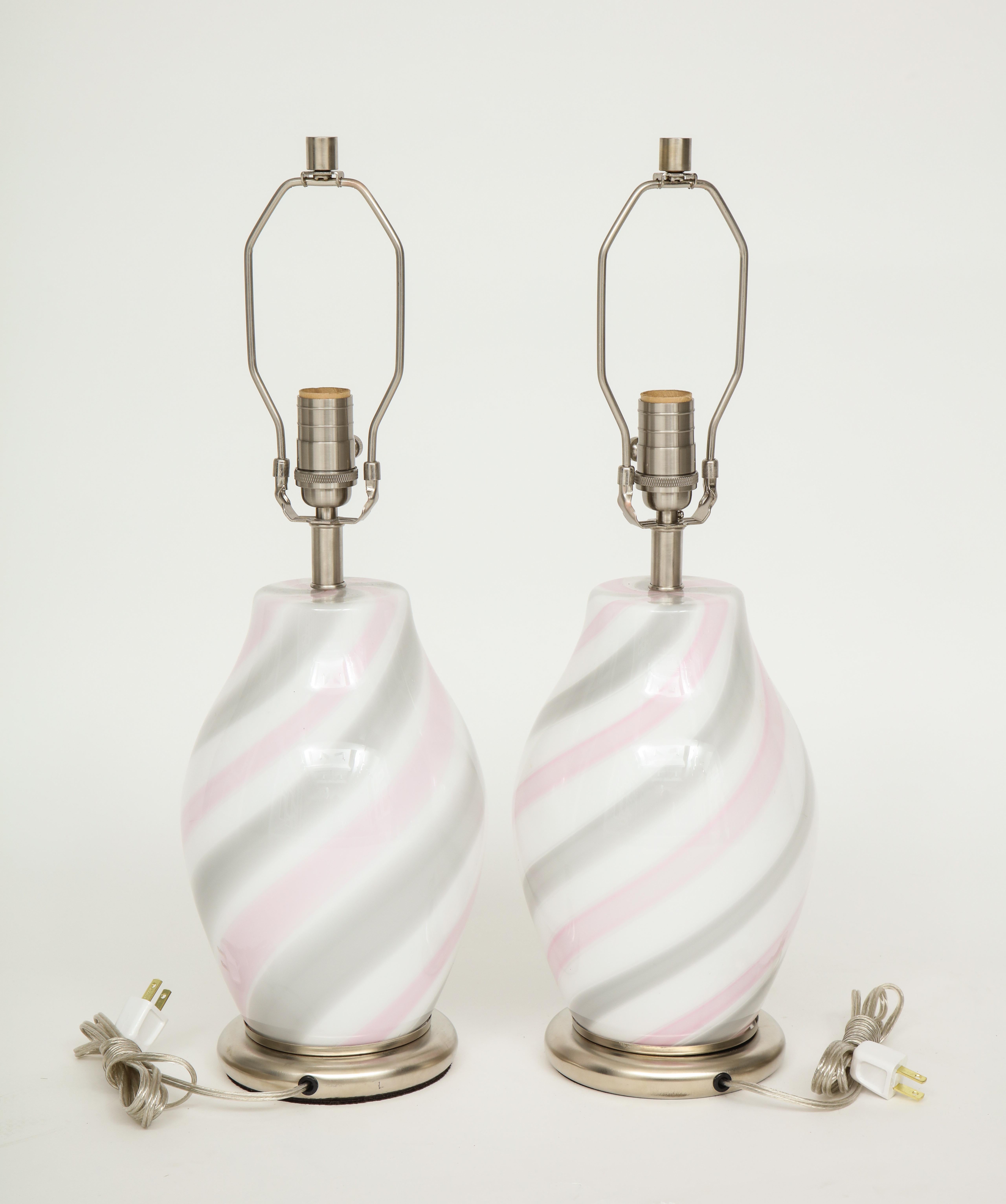 Pair of Midcentury Murano glass lamps with pink and grey spiral design on satin nickel bases, by Vetri. Rewired for use in the USA. 100W max bulbs. Glass body measures 12 inches.