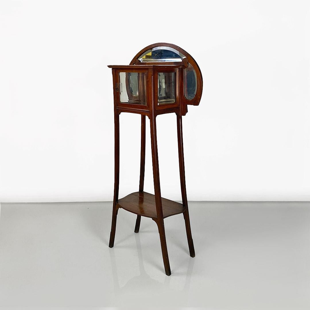 Italian liberty walnut étagère with showcase, late 1800-early 1900. Liberty etagere in walnut equipped with showcase and grinding mirror. Small container mirrored module in the internal part as well as shelf in the lower part of the structure.