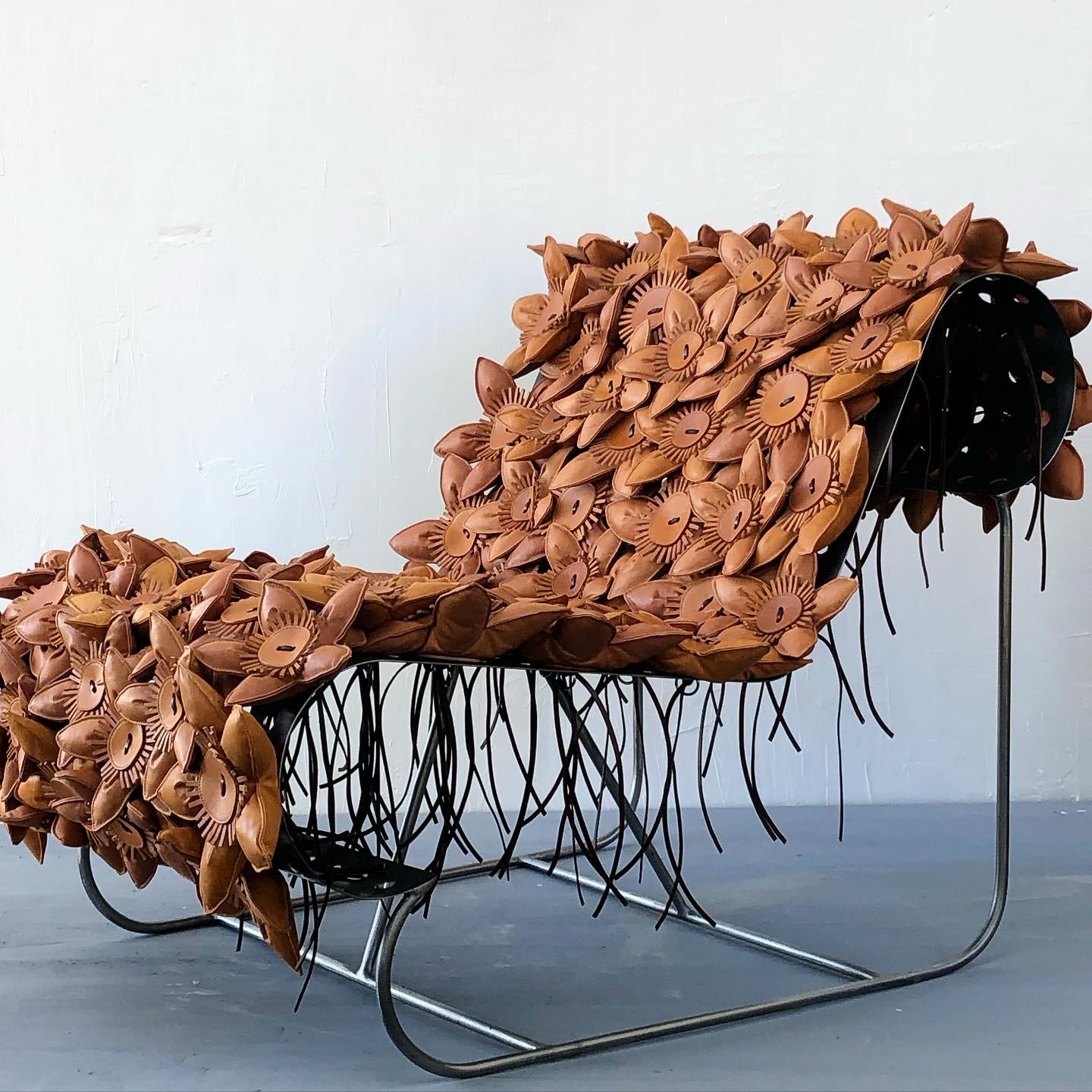 To be seated within a bouquet of blooming passion flowers, immersed in petals. Constructed from a bent perforated industrial plate structure, to which soft leather flowers
Are hand tied and fixed by chrome rings. The seat is bouncy, and