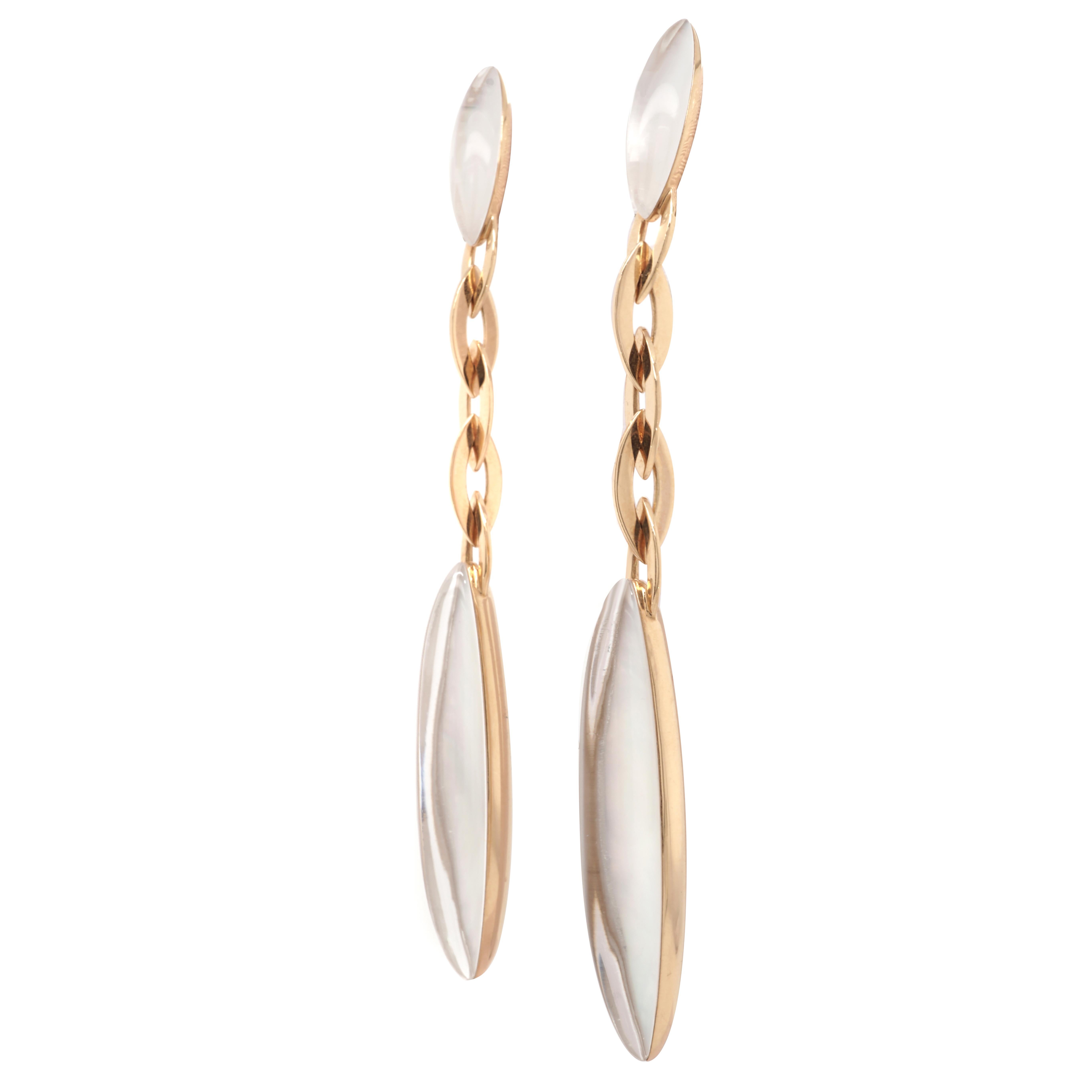 Crafted by Vhenier, these beautiful long drop earrings feature 4 marquise shape cabochon cut rock crystal backed with mother of pearl are set in 18 karat yellow gold.
Signed: Vhenier stamped: 750
Dimensions: L 3 1/2