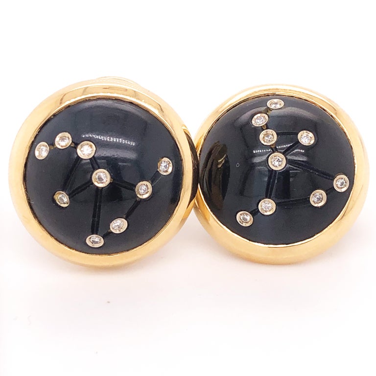 Original 1990's, Absolutely Chic yet Timeless, extremely rare Clip-On 18K Yellow Gold Earrings combining 0.20Kt, 18 White Diamond (D-E, IF) set in an absolutely Unique Hawk's Eye Hand Inlaid Round Cabochon.
Founded in 1984 by a Collective of
