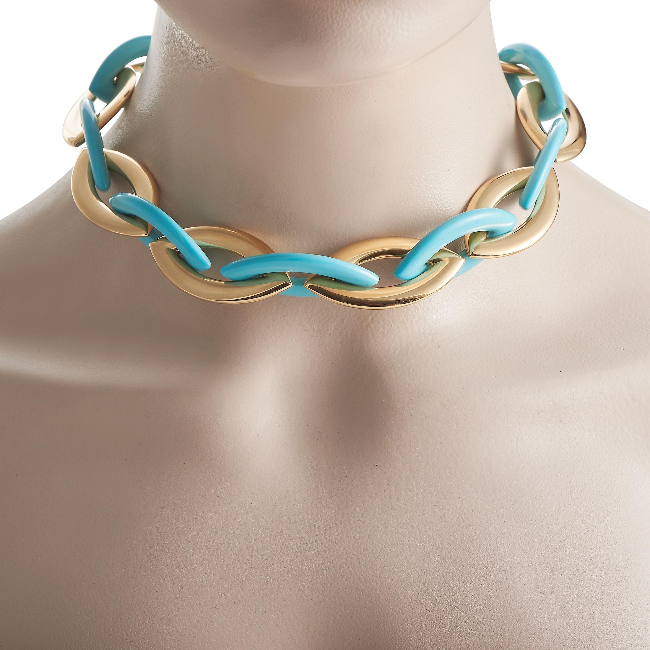 Add a bold pop of color to any ensemble by adding this luxurious Vhernier Doppio Senso collar necklace. Oblong links made from 18K Yellow Gold pair beautifully with bright turquoise links - the result is a stunning accessory that measures 18”