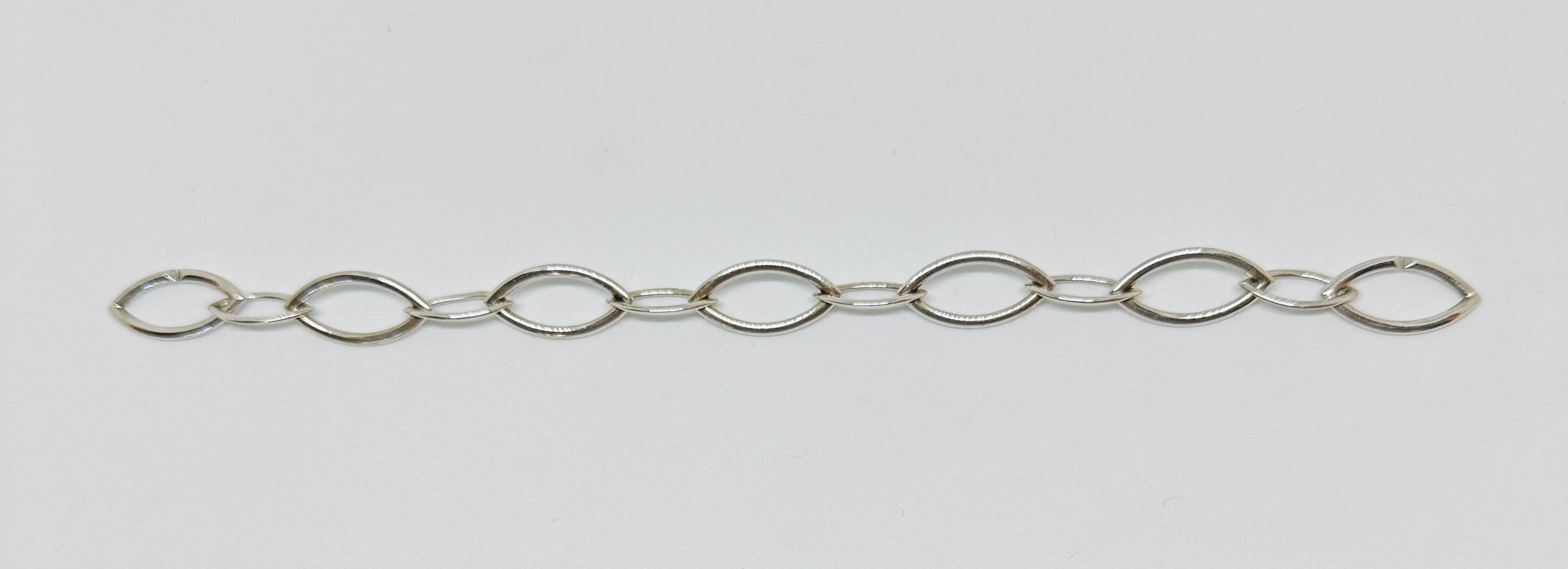 Extremely rare sterling silver link bracelet from the Doppio Senso collection by Vhernier Milano.

The sculptural links move easily on the wrist. The bracelet, marked VHERNIER, 925 and Italy, is 8 inches in length and is in excellent pre-owned