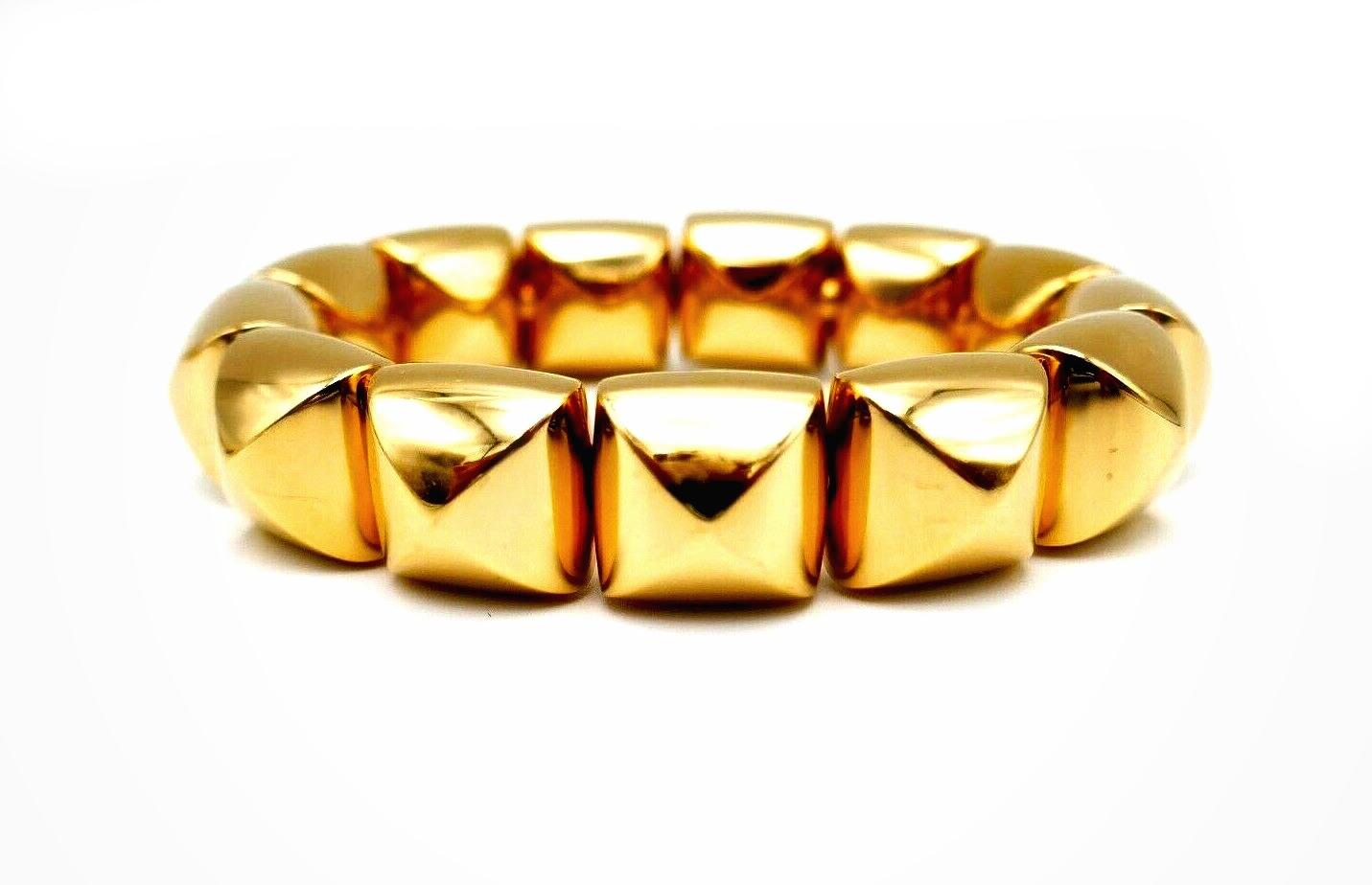 Open bracelet comprised of polished yellow gold pyramids, slip-on style. From Freccia collection by Vhernier. Stamped with Vhernier maker's mark, a hallmark for 18k gold and a serial number.
Measurements: length is 5