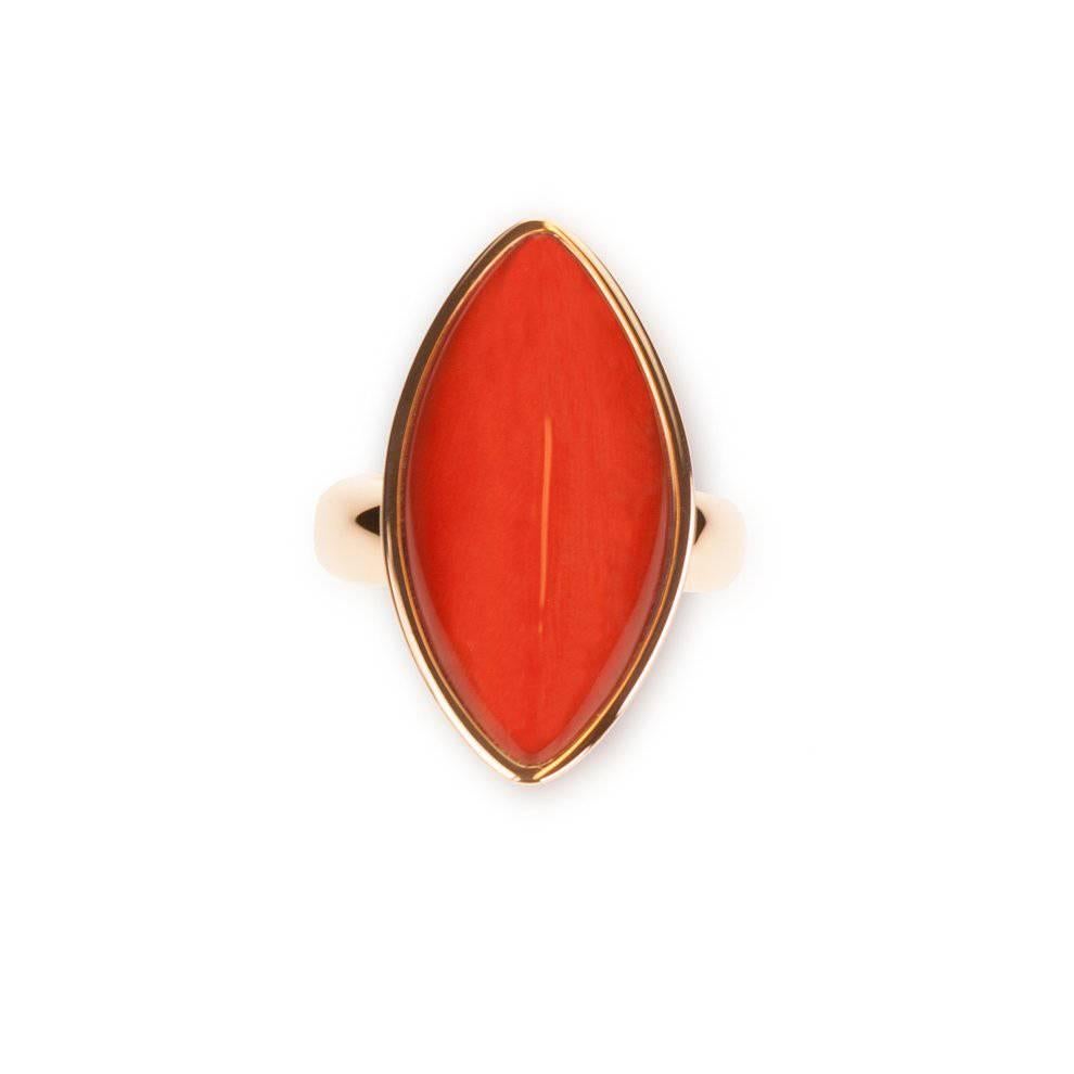 A Vhernier Flexible 18 Karat Rose Gold "Navette" Ring in Beautiful Coral with a Top Layer of Rock Crystal Quartz. 
(Stamped: "21B, VHERNIER, 750, * 3229 AL")

Size 6.5 (EUR 53)

Suggested Retail: $9,000.00