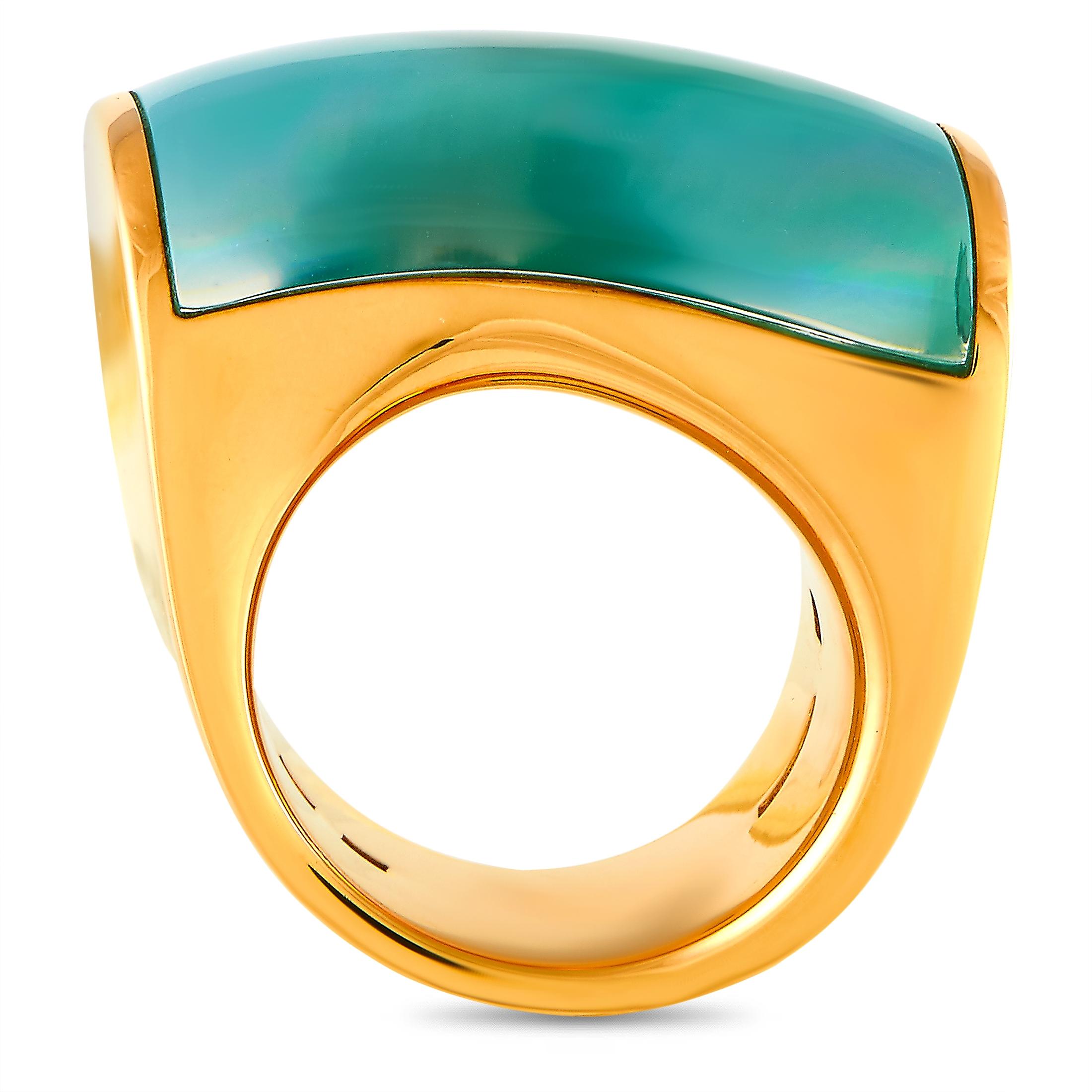 The Vhernier “Onda Grande” ring is crafted from 18K rose gold and set with mother of pearl, chrysoprase, and rock crystal. The ring weighs 30 grams and boasts band thickness of 16 mm and top height of 9 mm, while top dimensions measure 25 by 16