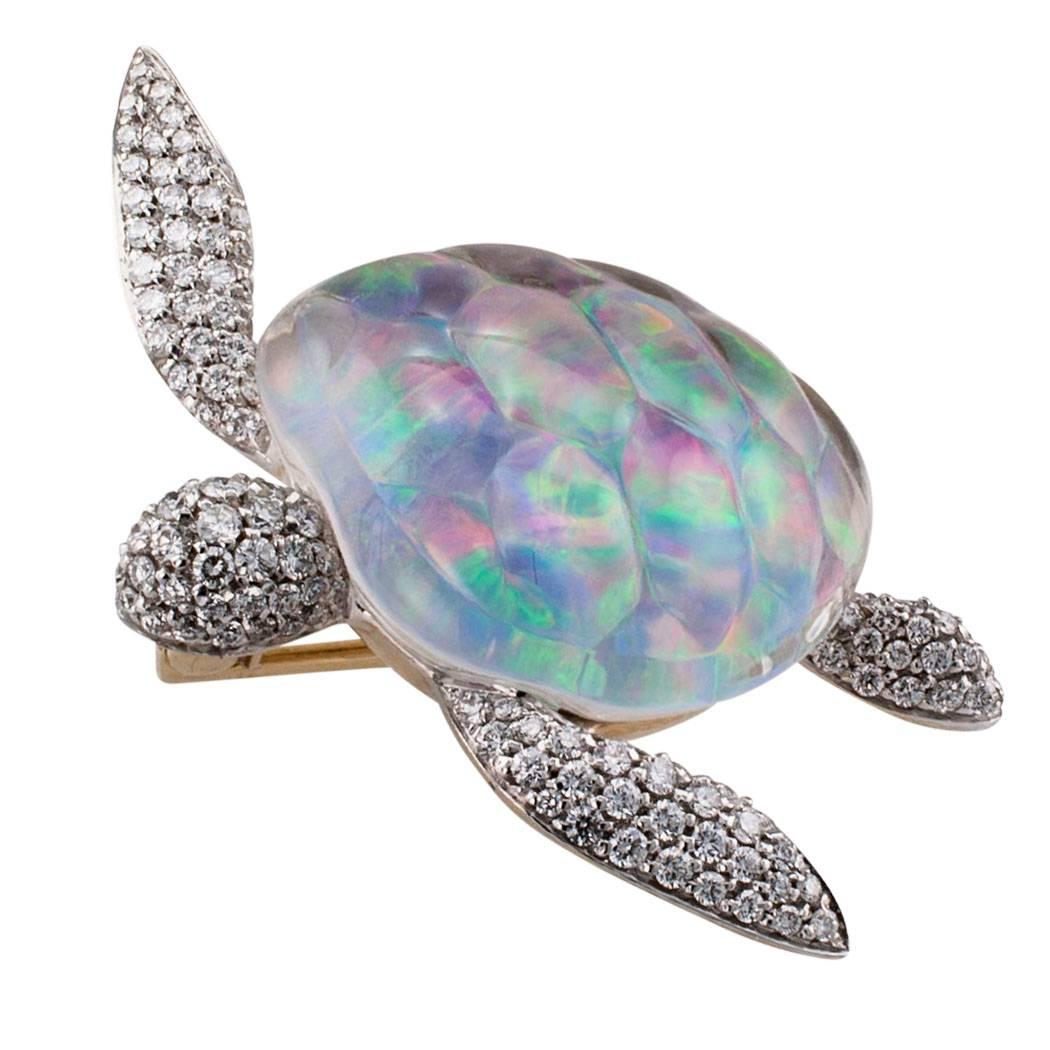 Vhernier sea turtle brooch set with opal diamonds and rock crystal on gold. The exotic sea turtle brooch features a carved rock crystal shell backed with opal, the head and extremities pavé-set with one hundred fifty-one round brilliant-cut diamonds
