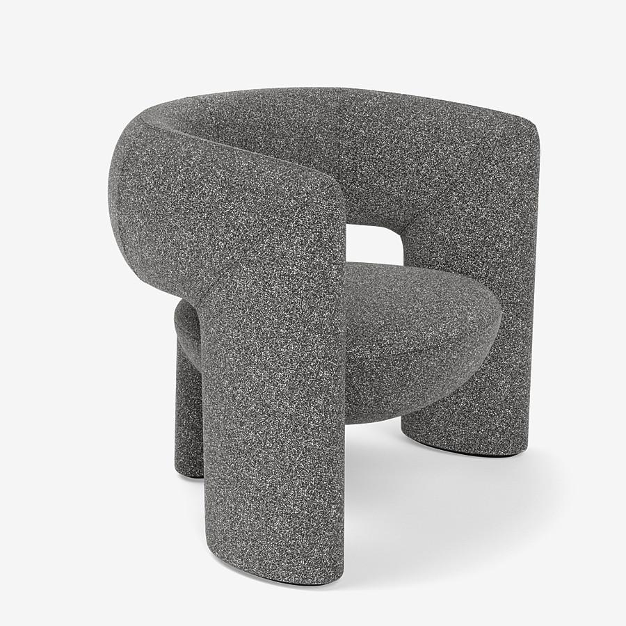 This Via del Corso lounge chair by Yabu Pushelberg is upholstered in Place de l'Étoile, muliti-toned bouclé. Place de l'Étoile comes in 5 colorways from Belgium with a composition of 65% Cotton, 20% Polyacrylic, 15% Polyester, a weight of 750g/m and