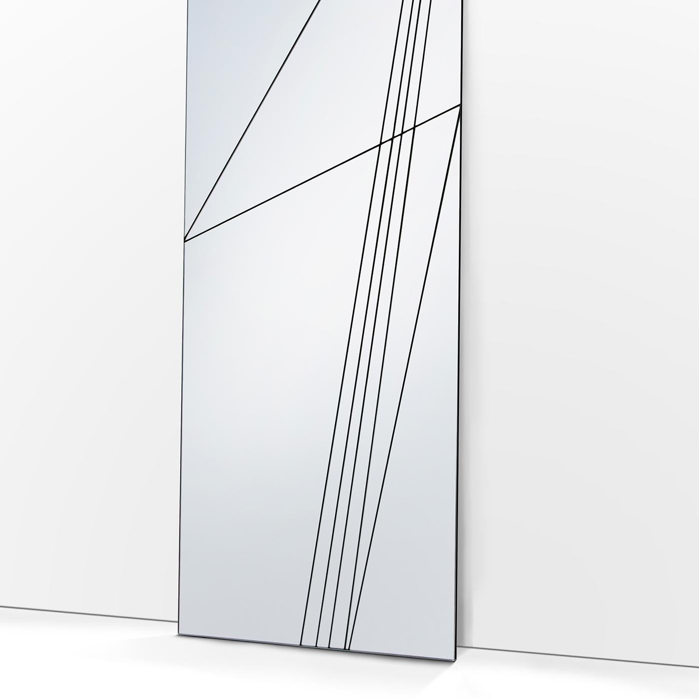 Part of the Via collection, this rectangular floor mirror creates captivating reflections with the surrounding environment. Its rigorous geometry is enlivened by a series of cuts on the surface that evoke a linear landscape reminiscent of ancient