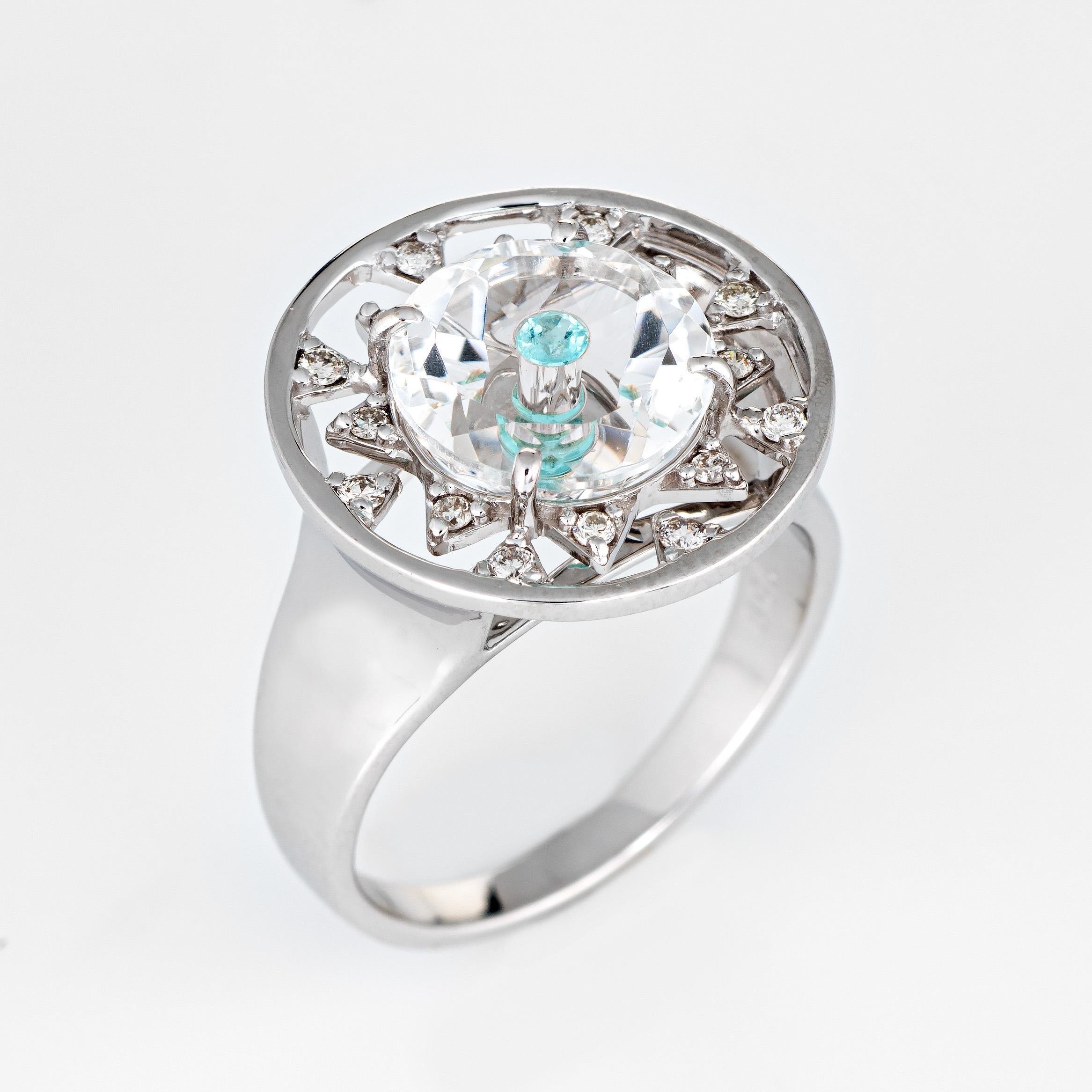 Stylish Vianna Brasil Paraiba & diamond cocktail ring crafted in 18 karat white gold. 

Paraiba tourmaline is estimated at 0.05 carats, accented with an estimated 0.32 carats of diamonds (estimated at H-I color and VS2-SI1 clarity). The tourmaline