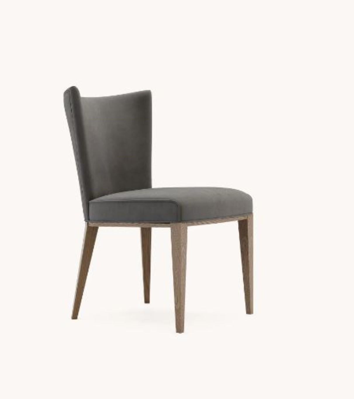 Vianna chair by Domkapa
Materials: Walnut Stained Ash, Velvet.
Dimensions: W 53 x D 65 x H 85 cm. 
Also available in different materials. Please contact us.

The epitome of comfort, the best description of Vianna chair. Supported by four wooden