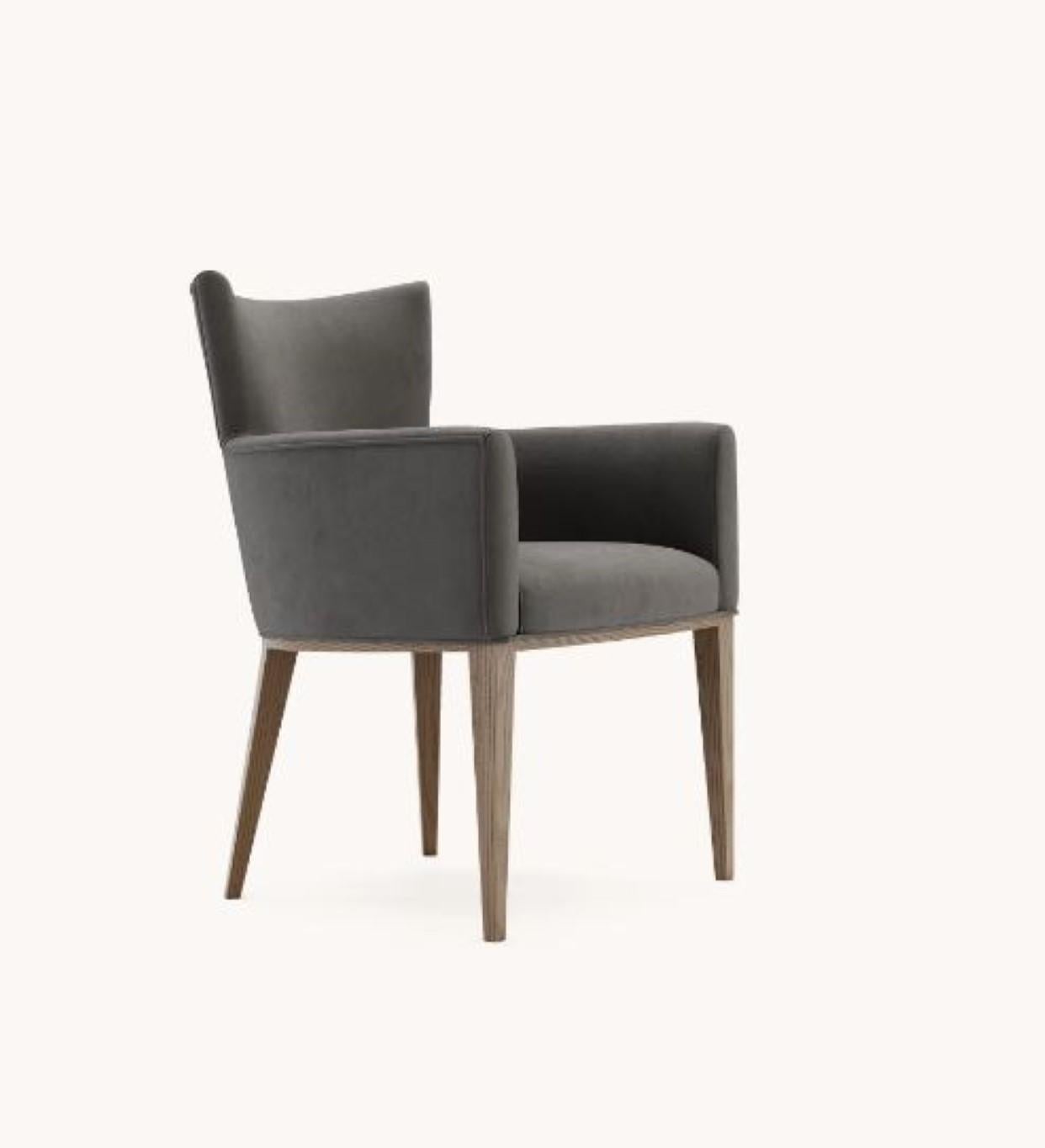 Vianna Chair by Domkapa
Materials: Walnut Stained Ash, Velvet.
Dimensions: W 62 x D 66 x H 85 cm. 
Also available in different materials. Please contact us.

The epitome of comfort, the best description of Vianna chair. Supported by four wooden