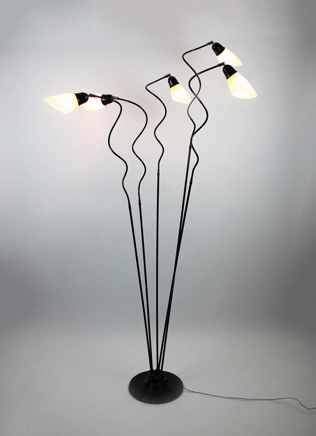 This vintage floor lamp is made of milk glass and comes from France. With lampshades made of the iconic Vianne glass, a well-known and influential manufacturer from France, this unique floor lamp immediately stands out in any kind of interior. With