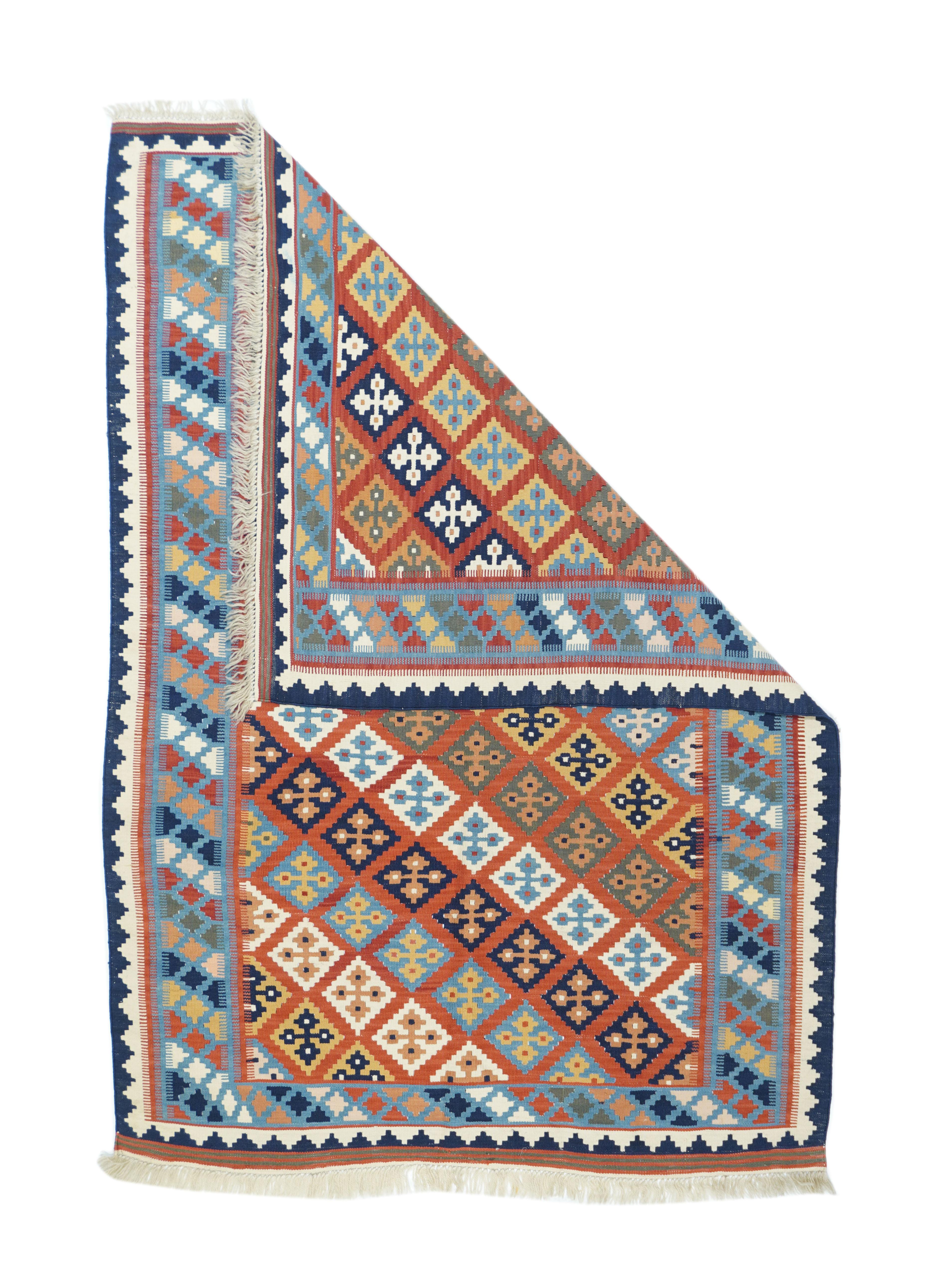 Vintage Kilim rug 3'10'' x 5'6''. Looks SW Persian, with a rust-red field displaying color diagonals of disjpoint diamonds in ecru, teal, dark blue and straw. Comb edges at border color joins. Light blue border of oblique color lines of small