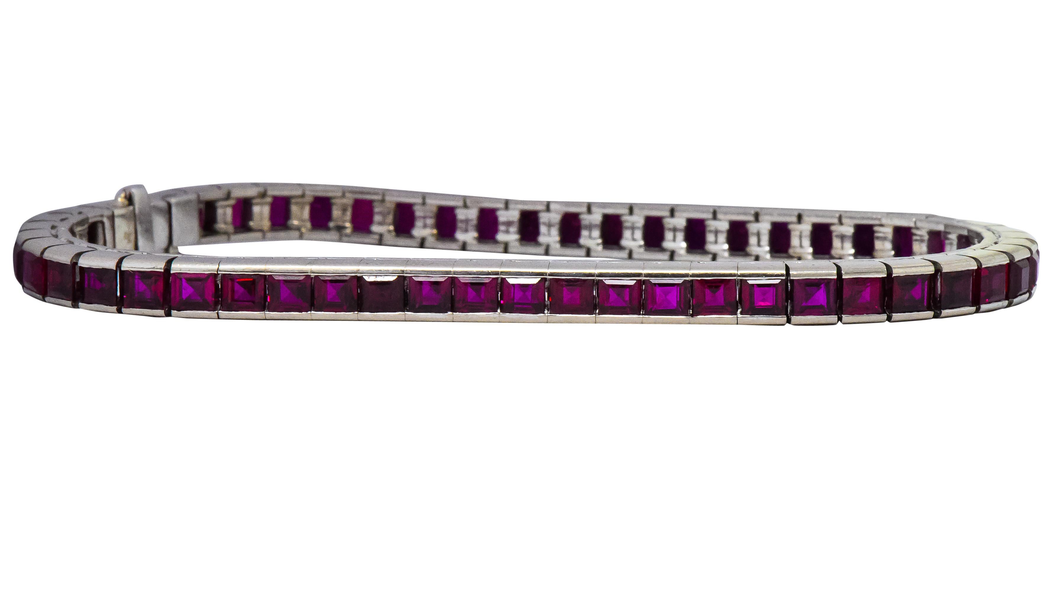 Sleek line bracelet comprised of streamline square links, each channel set with a square cut ruby

Fifty-three rubies weighing in total approximately 10.60 carats; all a very well-matched and 
vibrant slightly purplish-red color

Completed by a