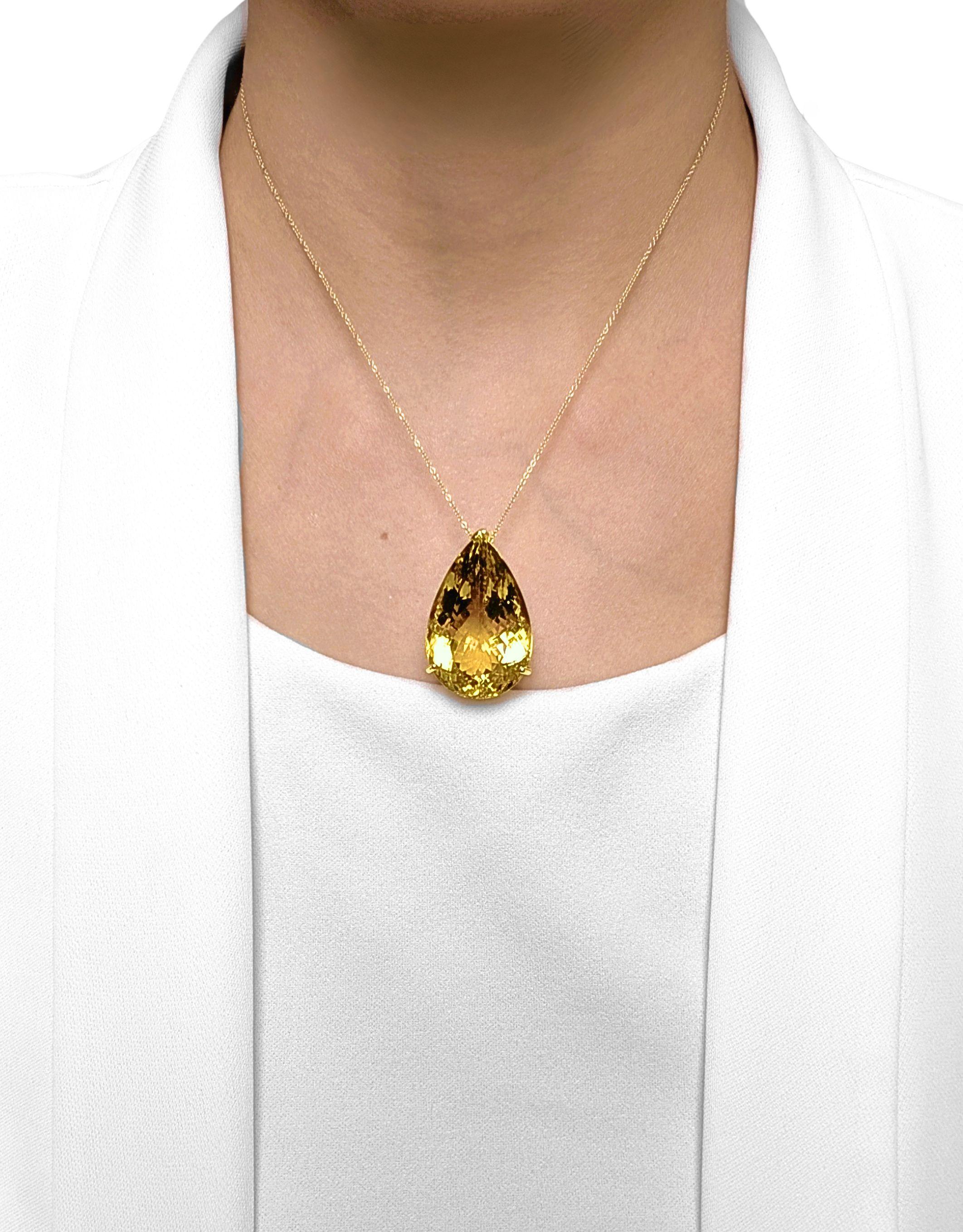 A burst of golden energy, this new-unworn pendant showcases a luminous 70ct pear-shaped citrine in a vivid yellow hue, radiating warmth and brilliance from every angle. Set in rich 18K yellow gold, the sleek prong design lets the gemstone shine with