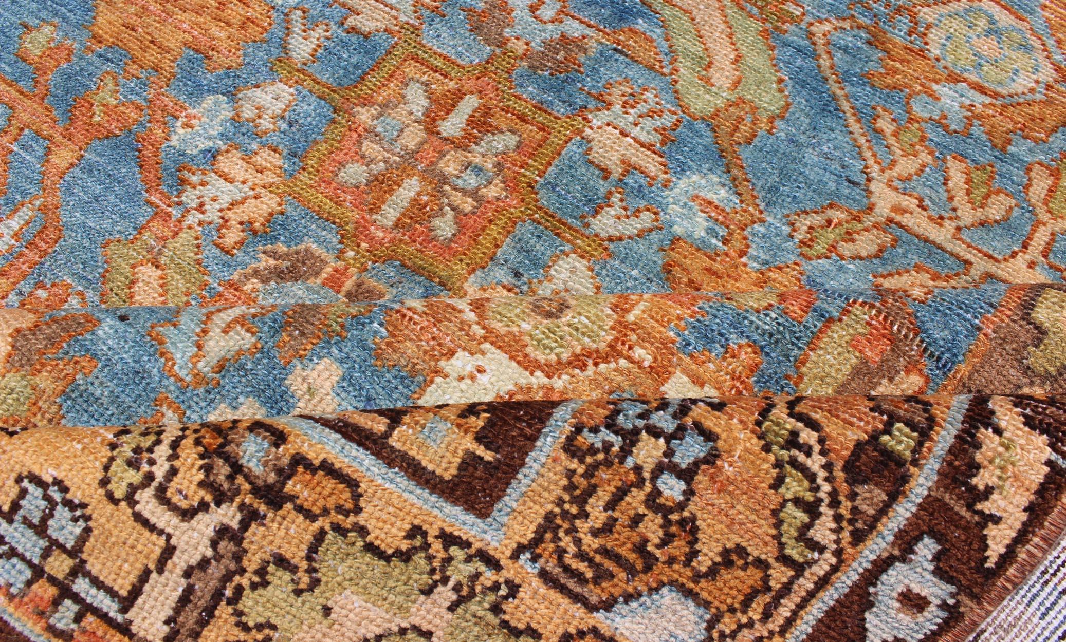 Early 20th Century Vibrant Antique Persian Malayer Rug in Shades of Rust, Orange, and Blue For Sale