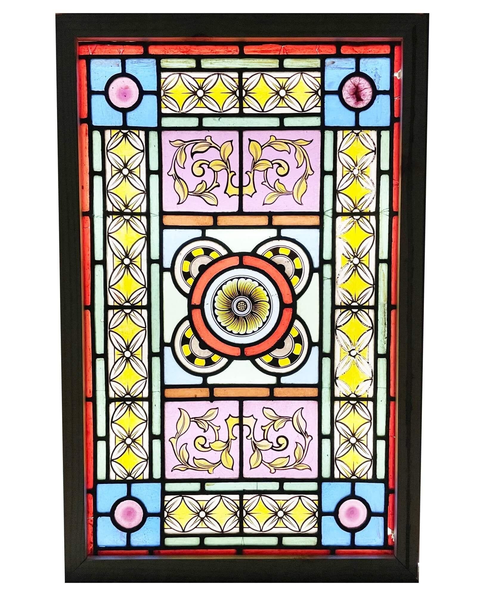 A vibrant antique Victorian floral stained glass window. This beautifully vibrant window dates from the late 19th century, but its intricate eye-catching design would make a spectacular focal point in properties old and new. Its centre holds a four