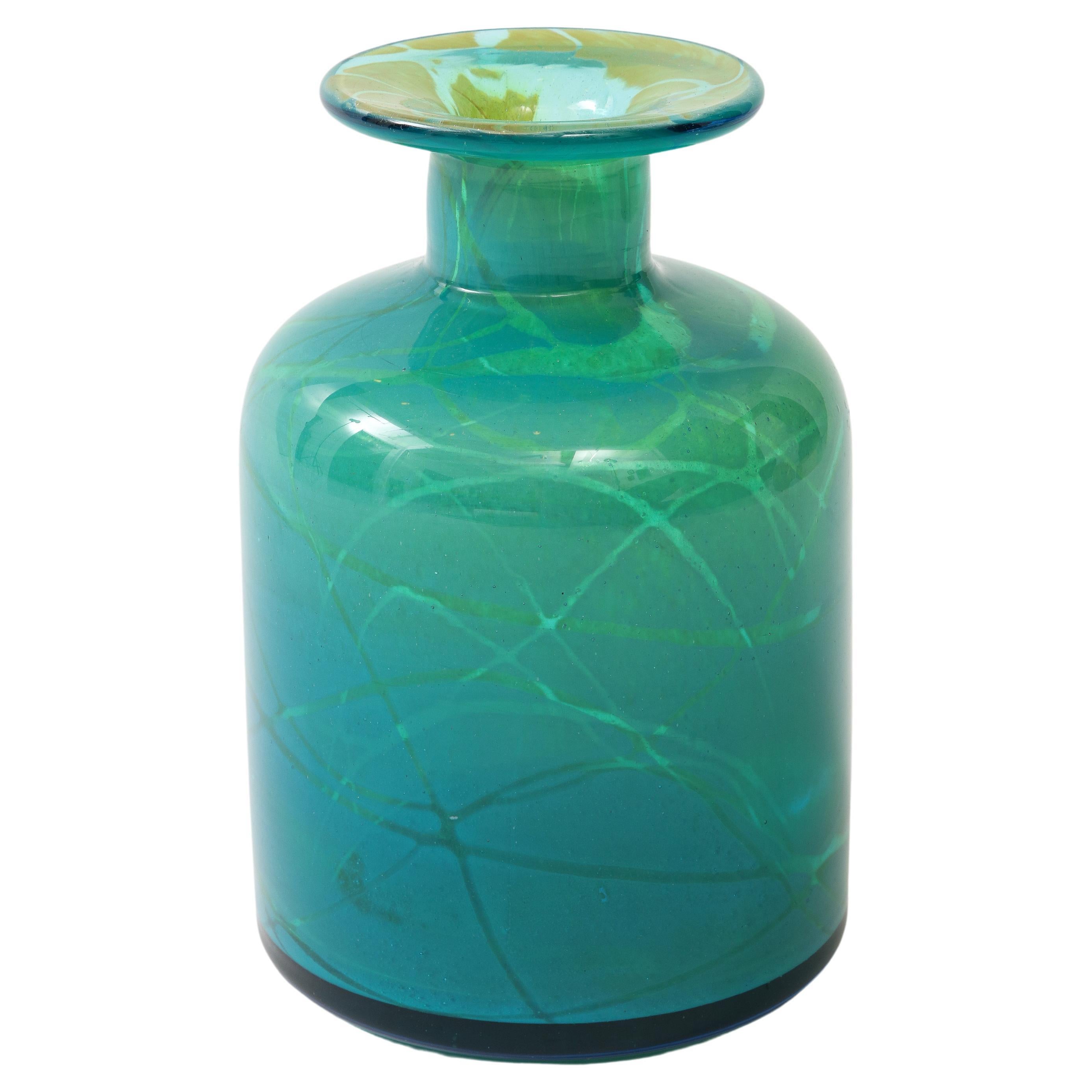 A typical vibrant blue Mdina glass bottle
shape vase by Micheal Harris.