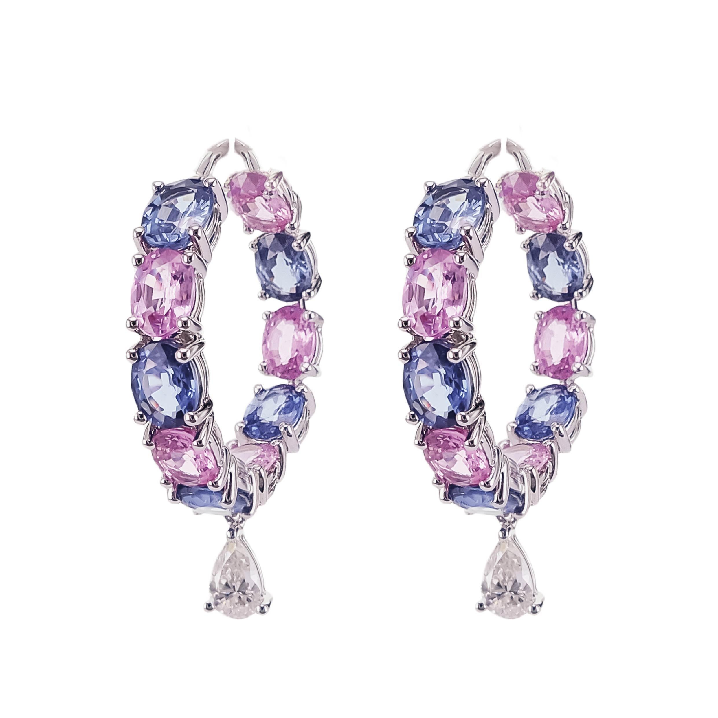 A lovely combination of blue and pink sapphire set along with white pear shape brilliant diamond brings this hoop design to life. A total of 8.43 carats of sapphire are set along with 0.48 carats of white pear shape diamond. What sets the design