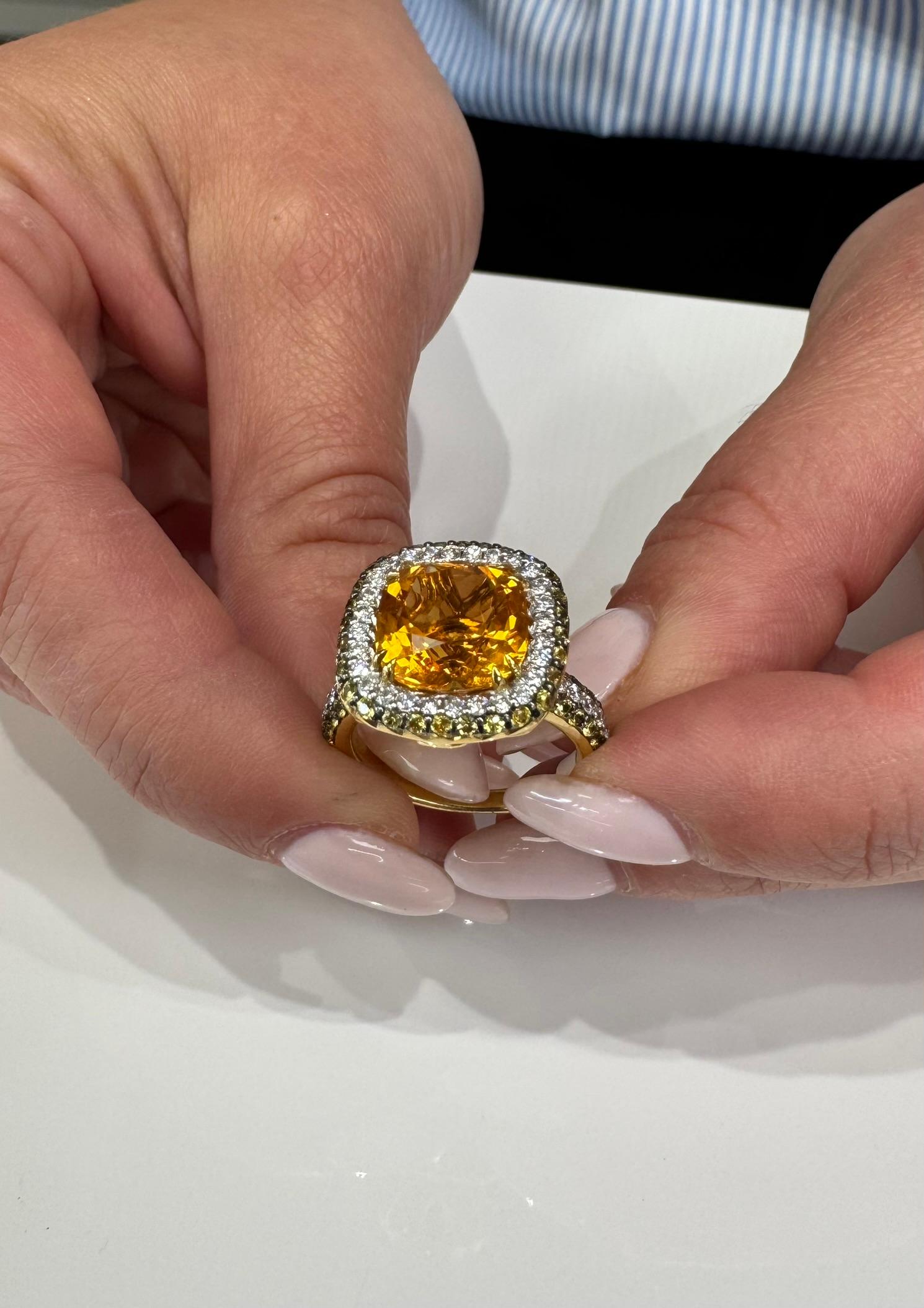 Vanna K 18K yellow gold double halo fashion ring.  The center features one citrine weighing 4.95 carats, which is set with double prongs that taper.  The double tapering prongs help showcase more of the center stone, adding finesse while keeping the